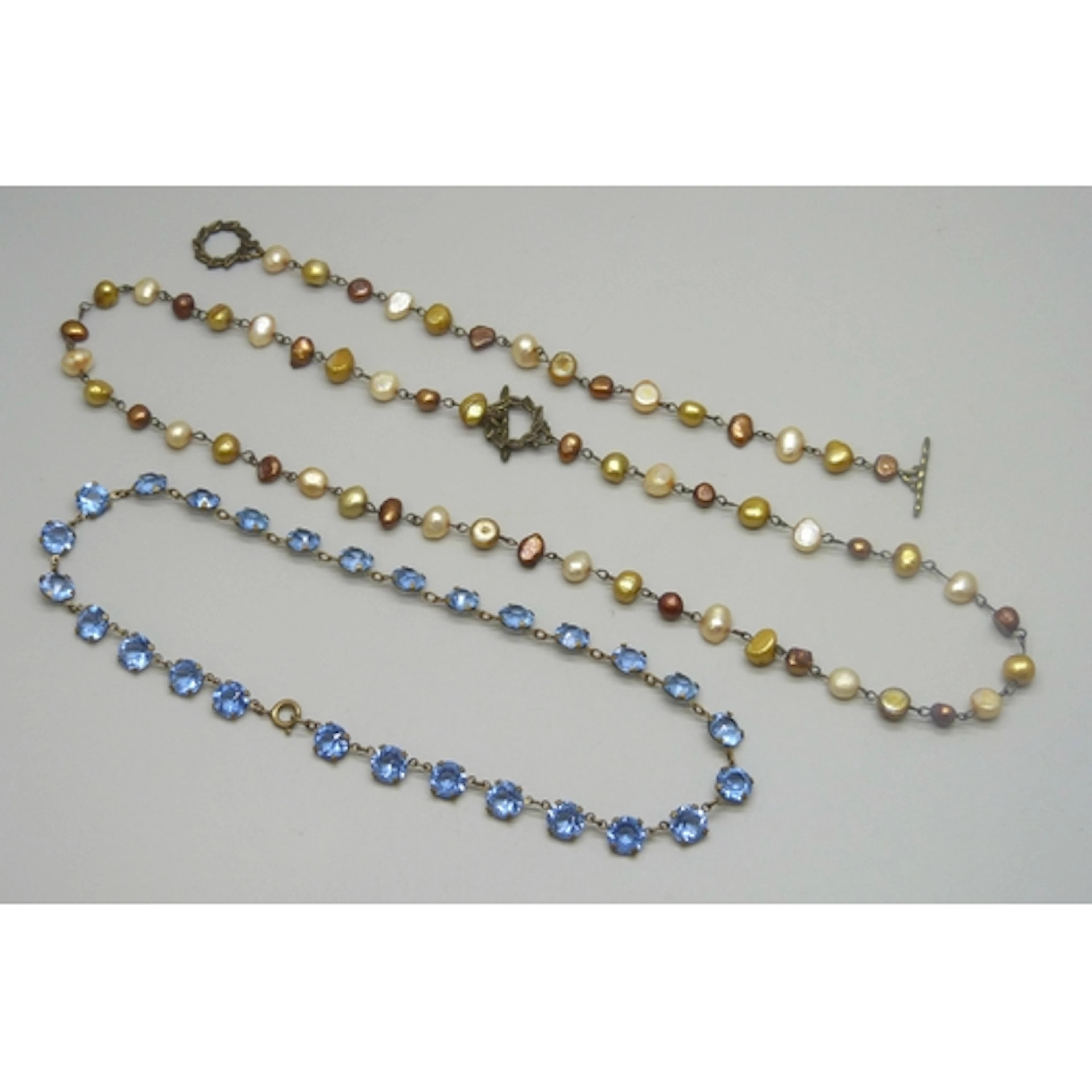 An Art Deco blue paste stone set riviere necklace, 38cm, and...