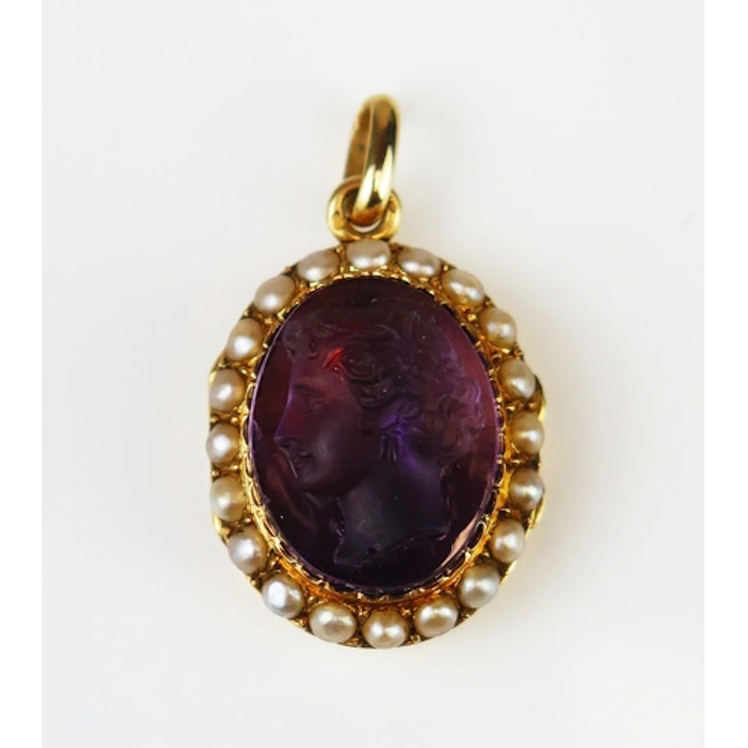 A carved hardstone cameo decorated with a female bust in pro...