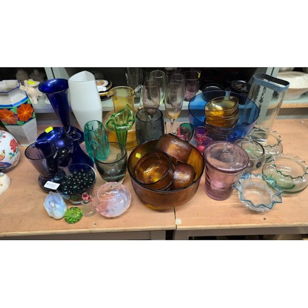 A quantity of coloured glass tableware and decorative object...