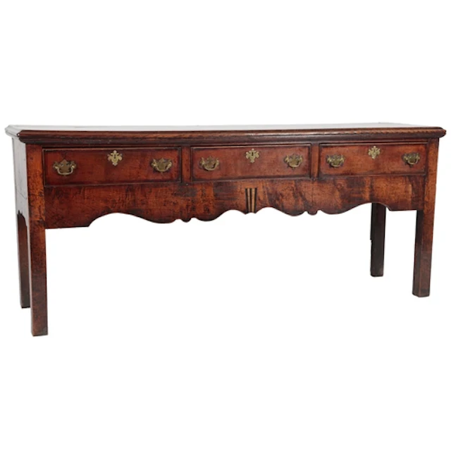 An oak and walnut crossbanded low dresser, mid-18th century,...