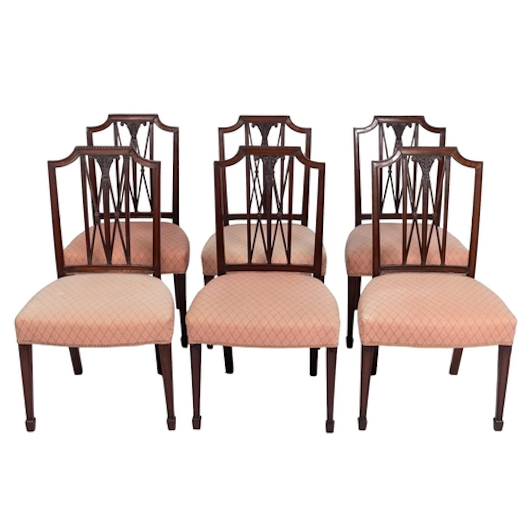 A set of six late 19th century carved mahogany dining chairs...