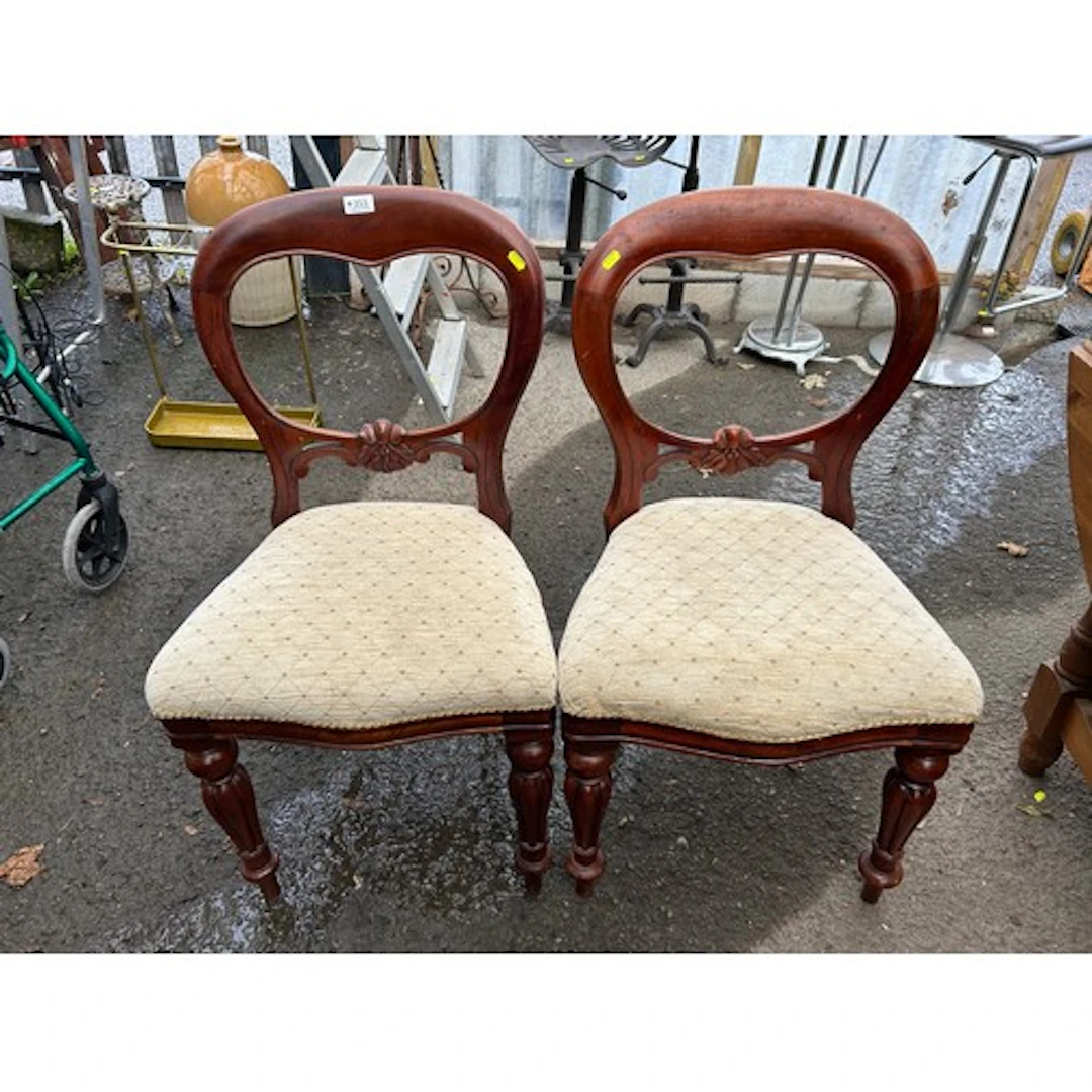 Pair of Victorian-style balloon-back side chairs in dark-fin...