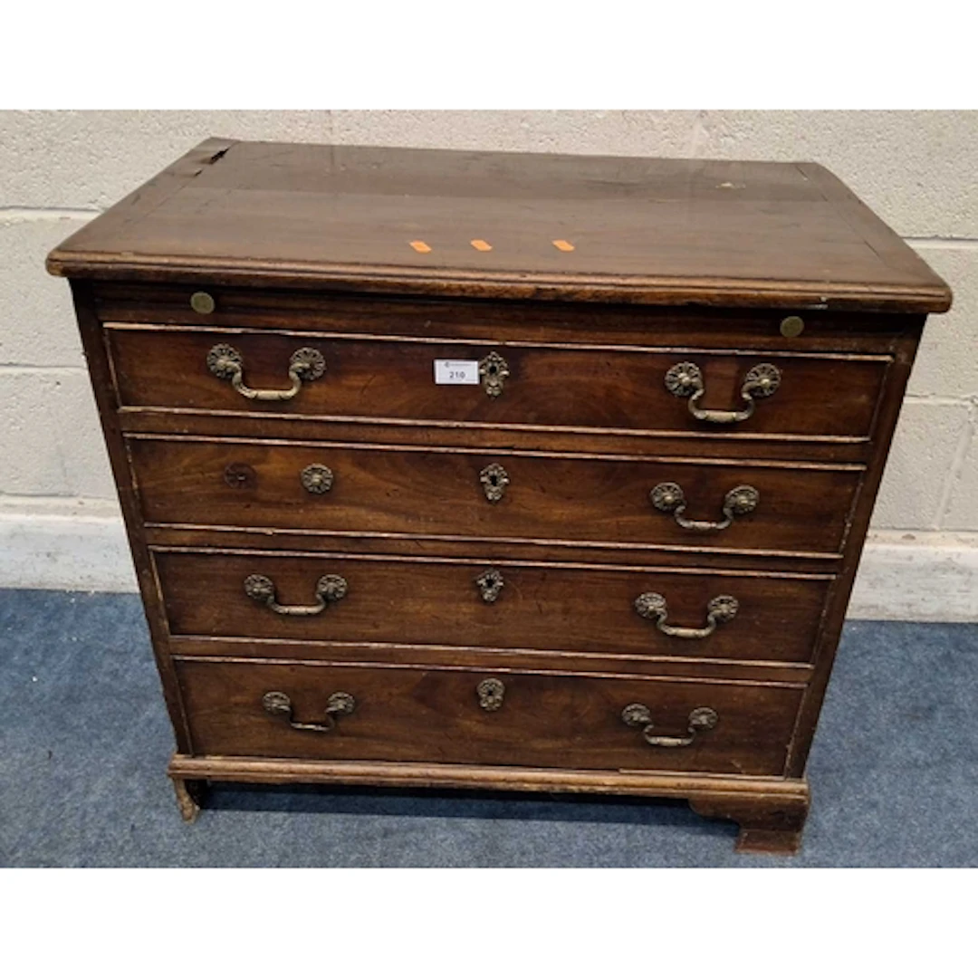 A GEORGIAN MAHOGANY CHEST OF FOUR GRADUATED DRAWERS, with a ...