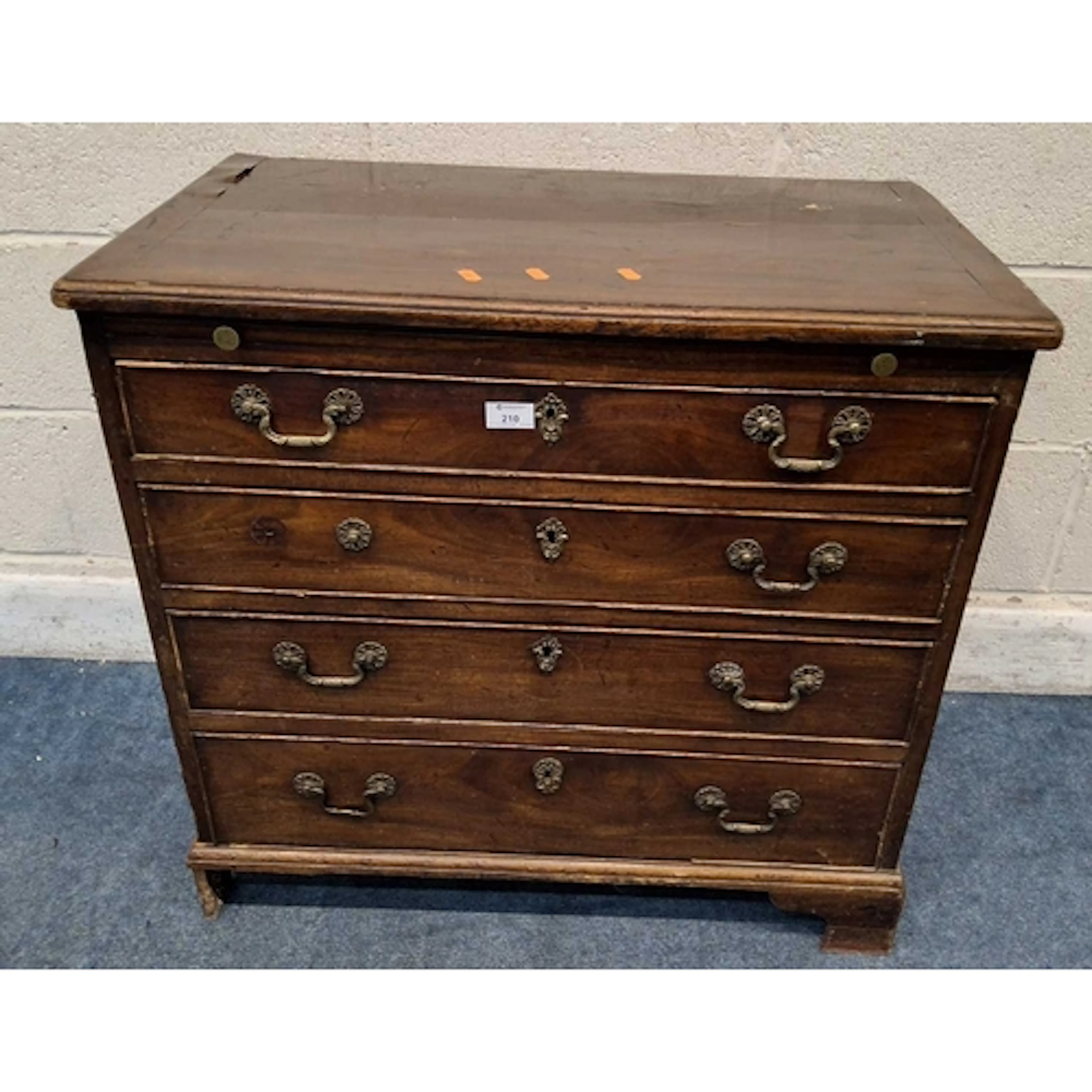 A GEORGIAN MAHOGANY CHEST OF FOUR GRADUATED DRAWERS, with a ...