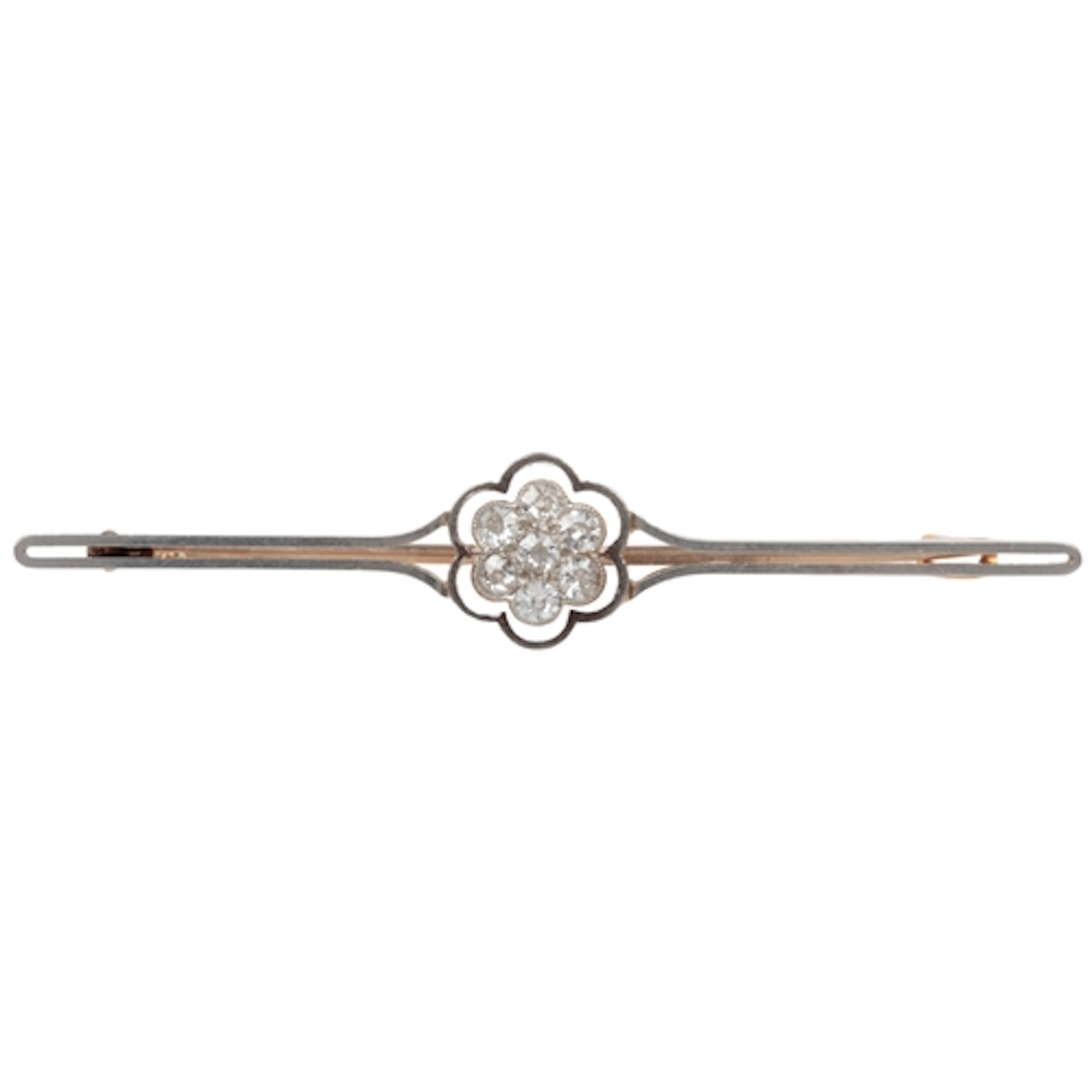 A diamond bar brooch, early 20th century, centring on a clus...