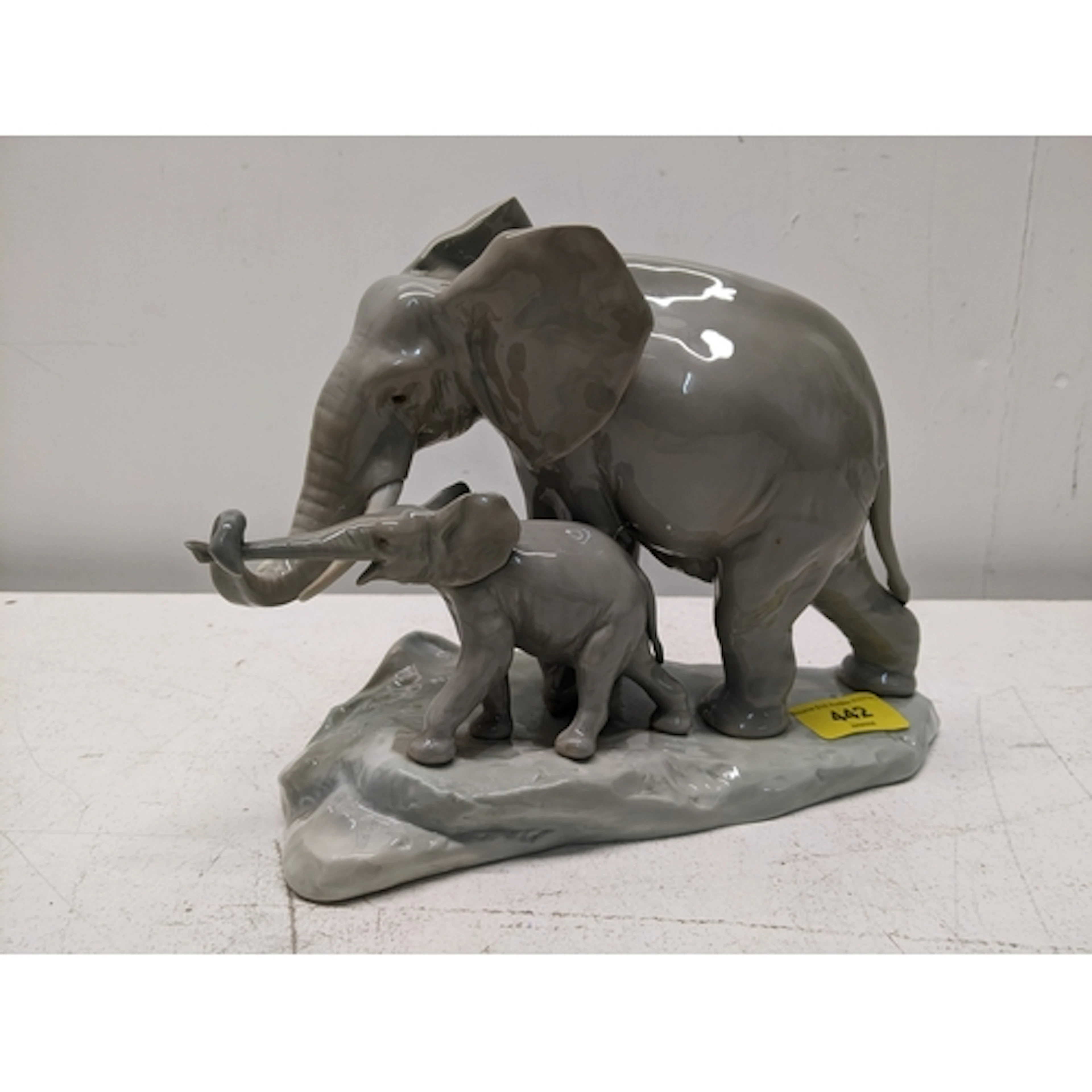 A Lladro model of an Elephant, with calf, 23cms long, 19cms ...