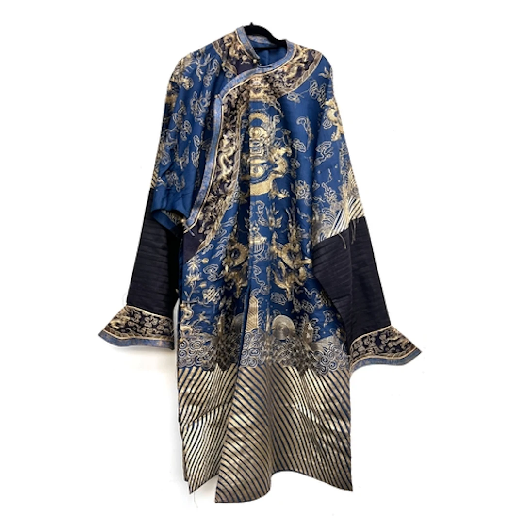 An antique Chinese navy blue and gold Jifu dragon robe, the ...