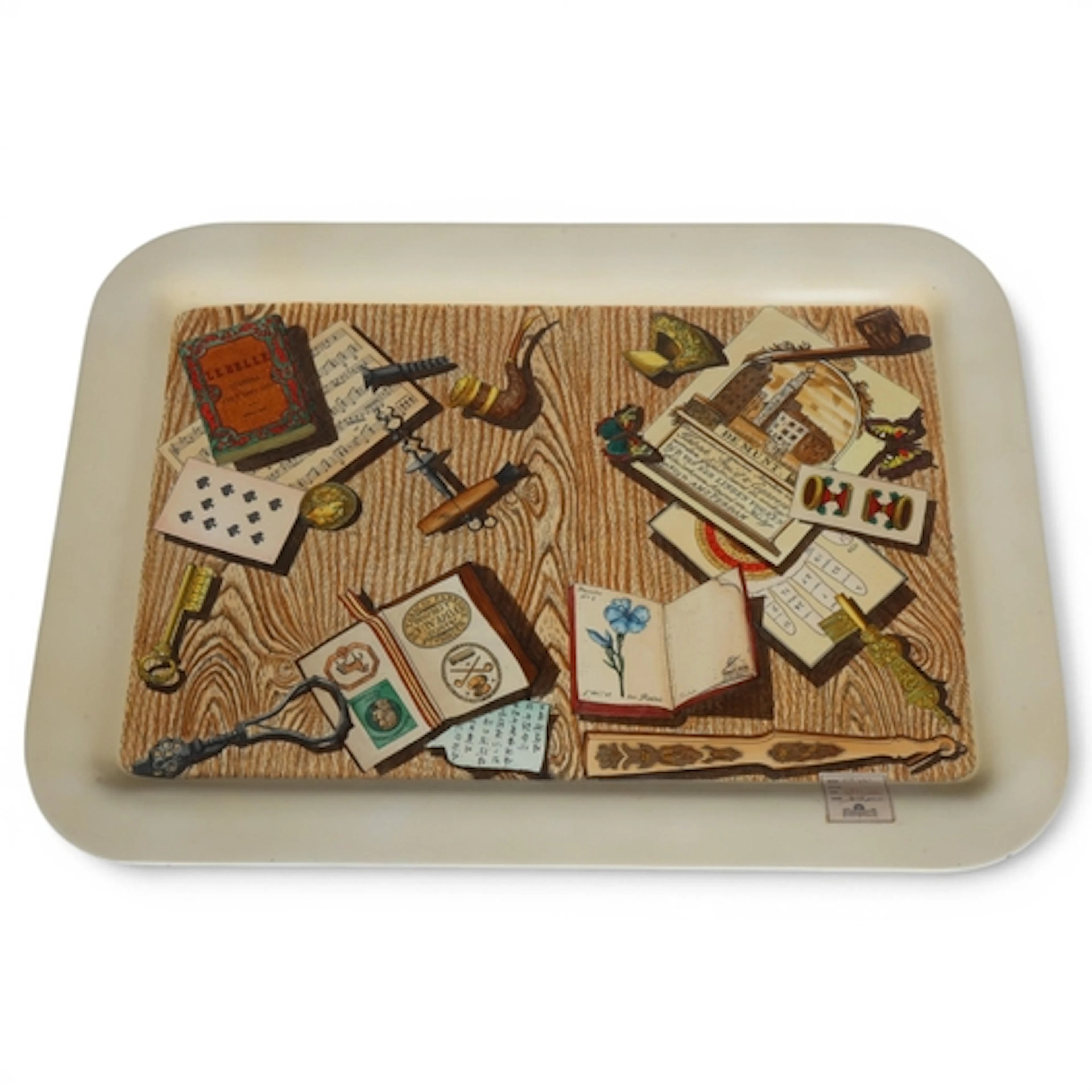 A large Fornasetti Trompe L'oeil tray, screen printed lacque...