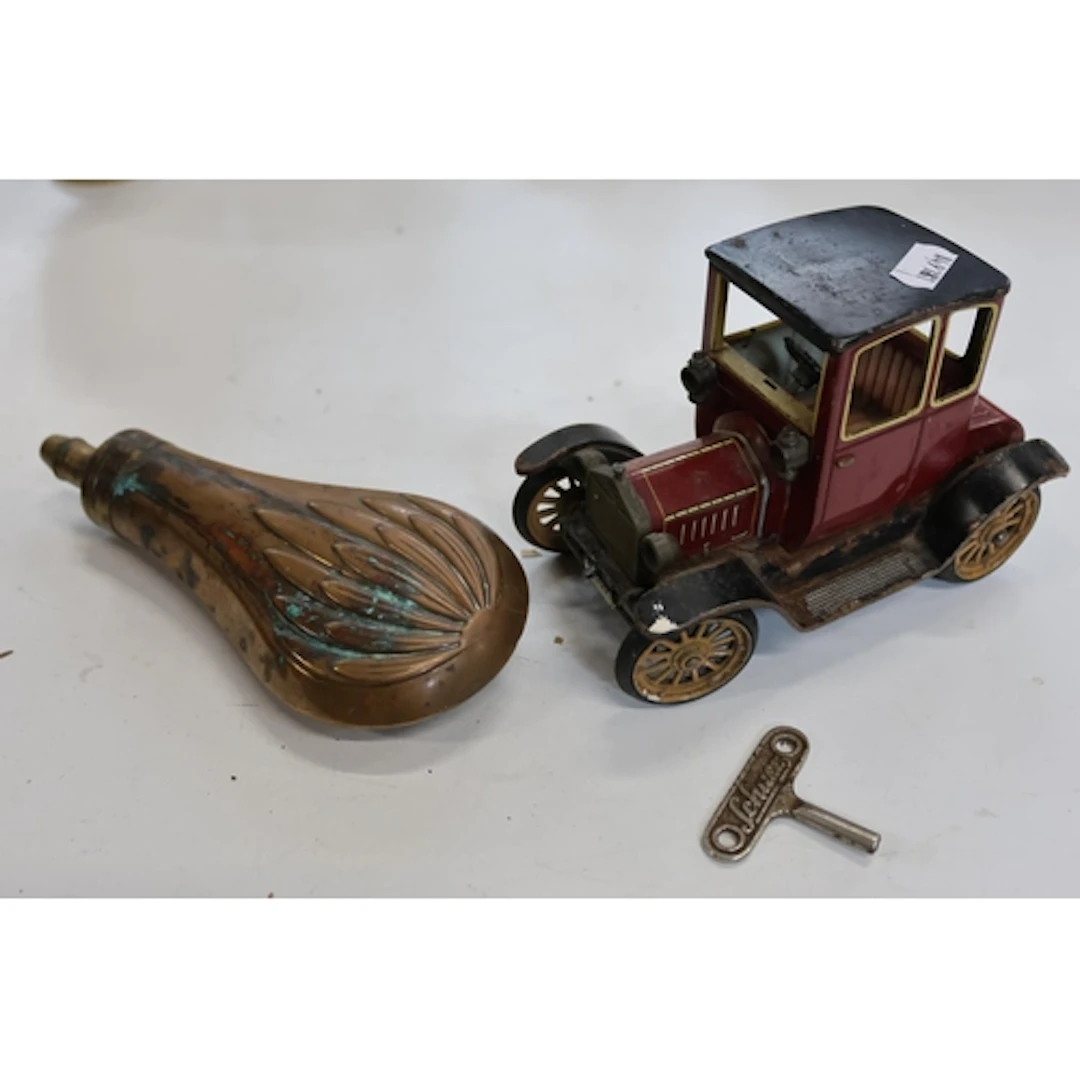 Schuco Ford 1227 clockwork model of a car and a copper shot ...