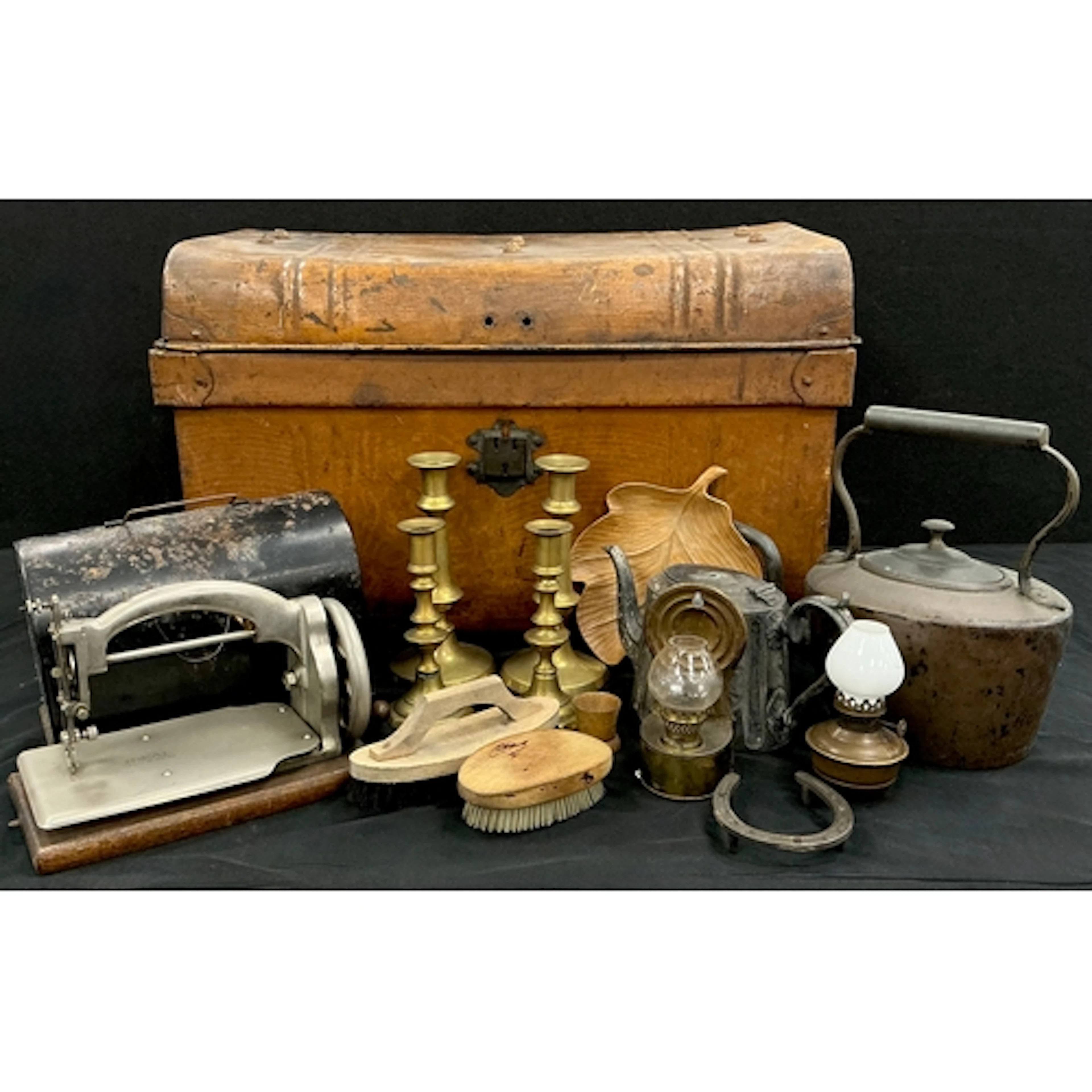 An early 20th century ideal mini sewing machine on oak base,...