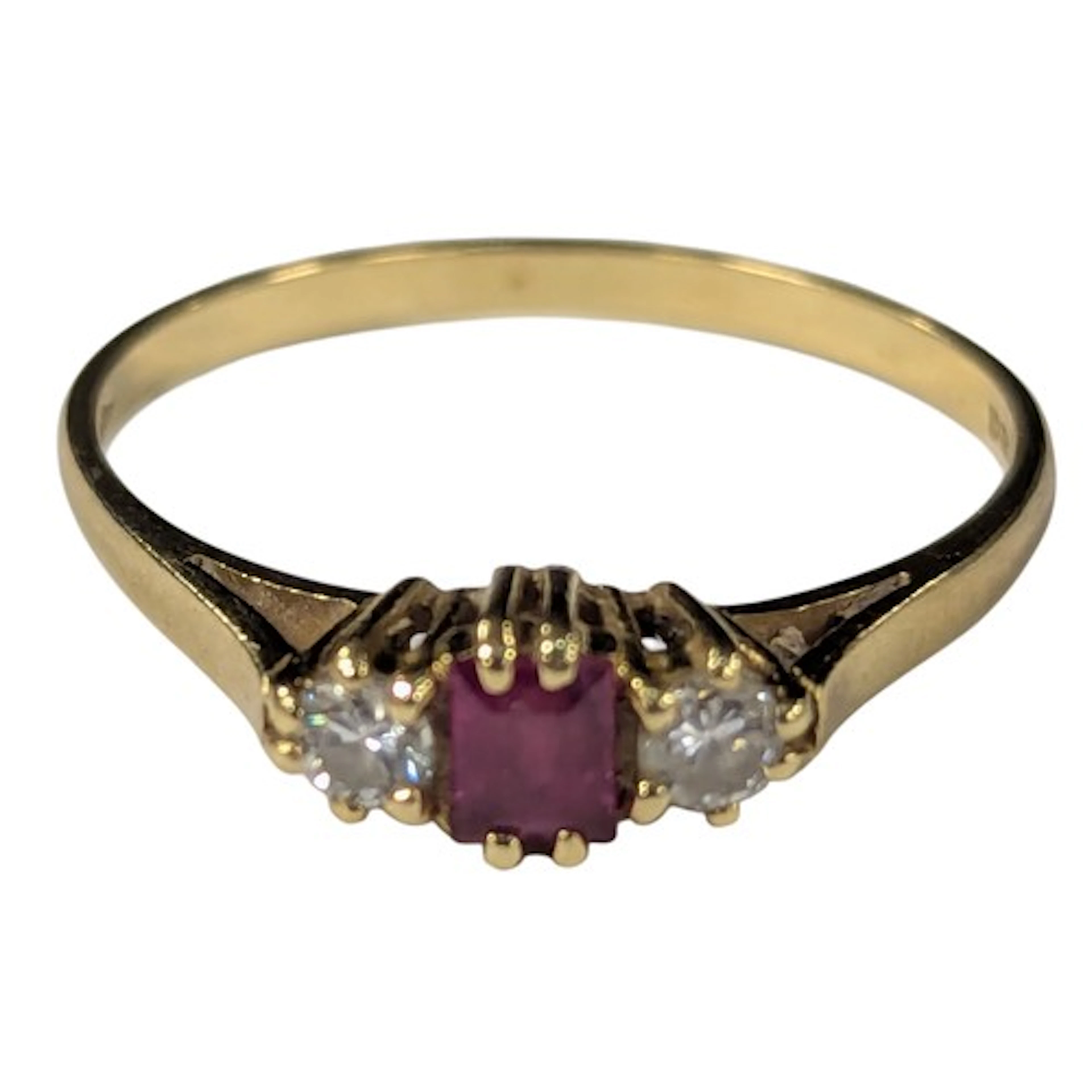 A ruby and diamond ring, central pale pink baguette ruby, ap...