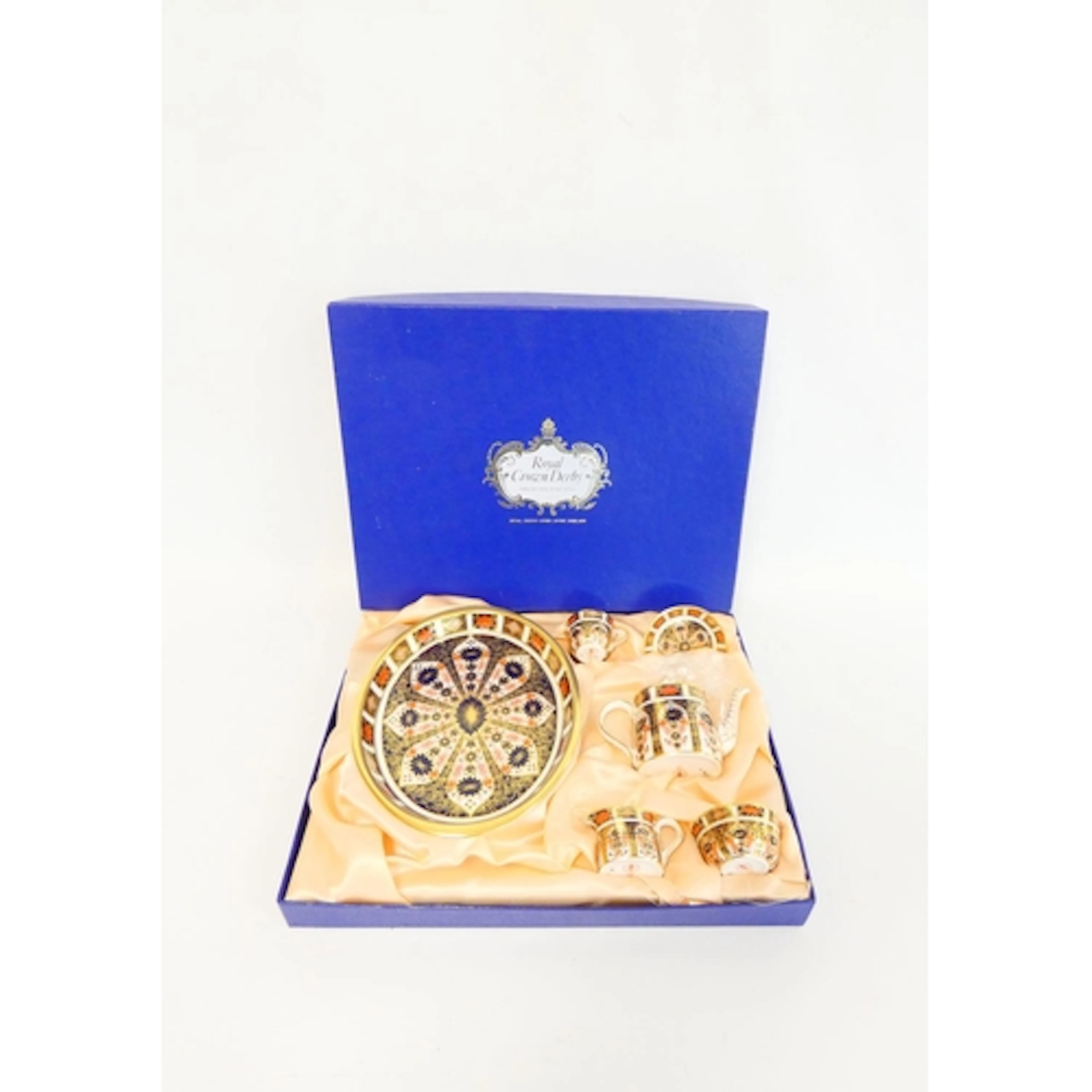 Royal Crown Derby. A boxed Imari pattern 1128 miniature teas...