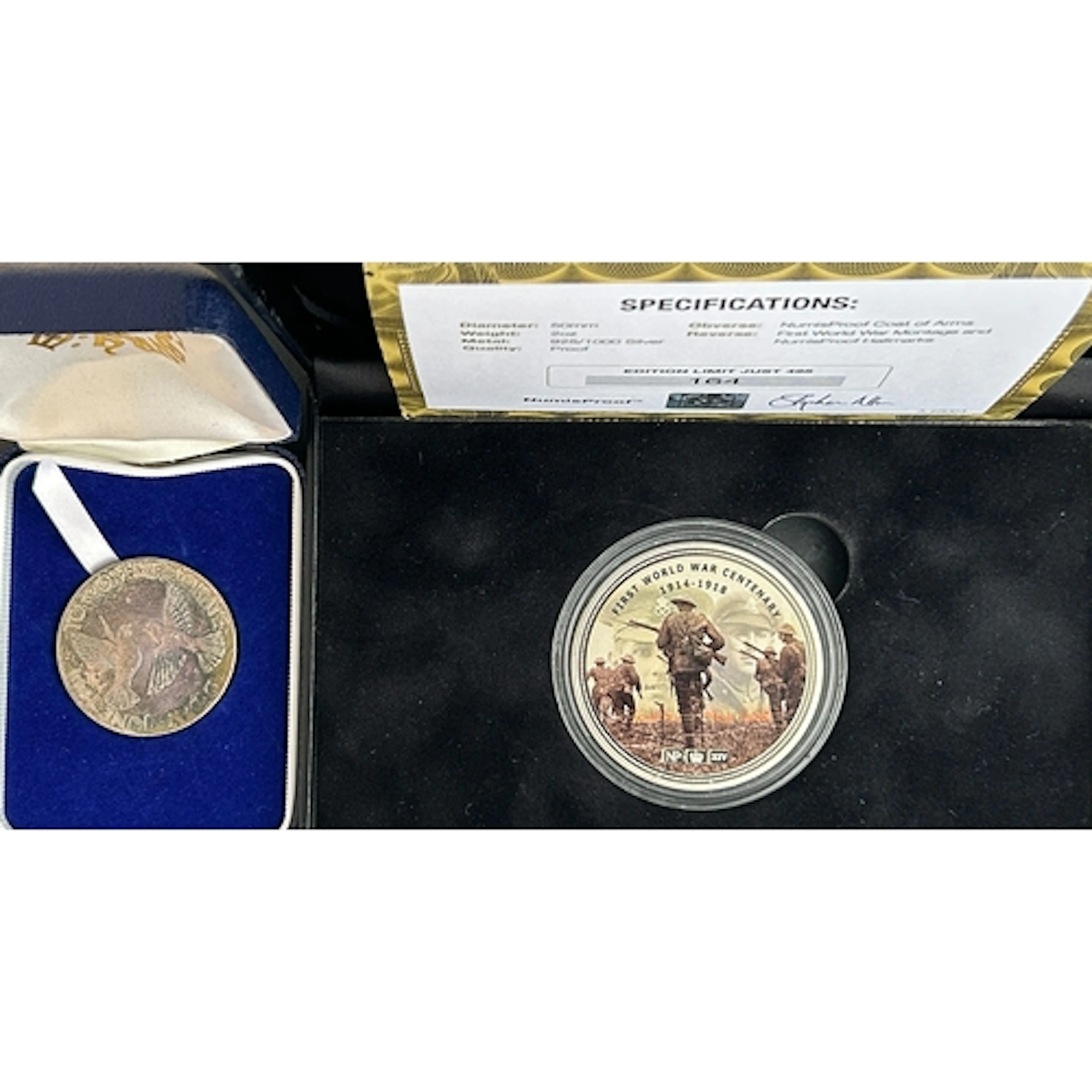 A pair of military-related silver commemorative medallions, ...