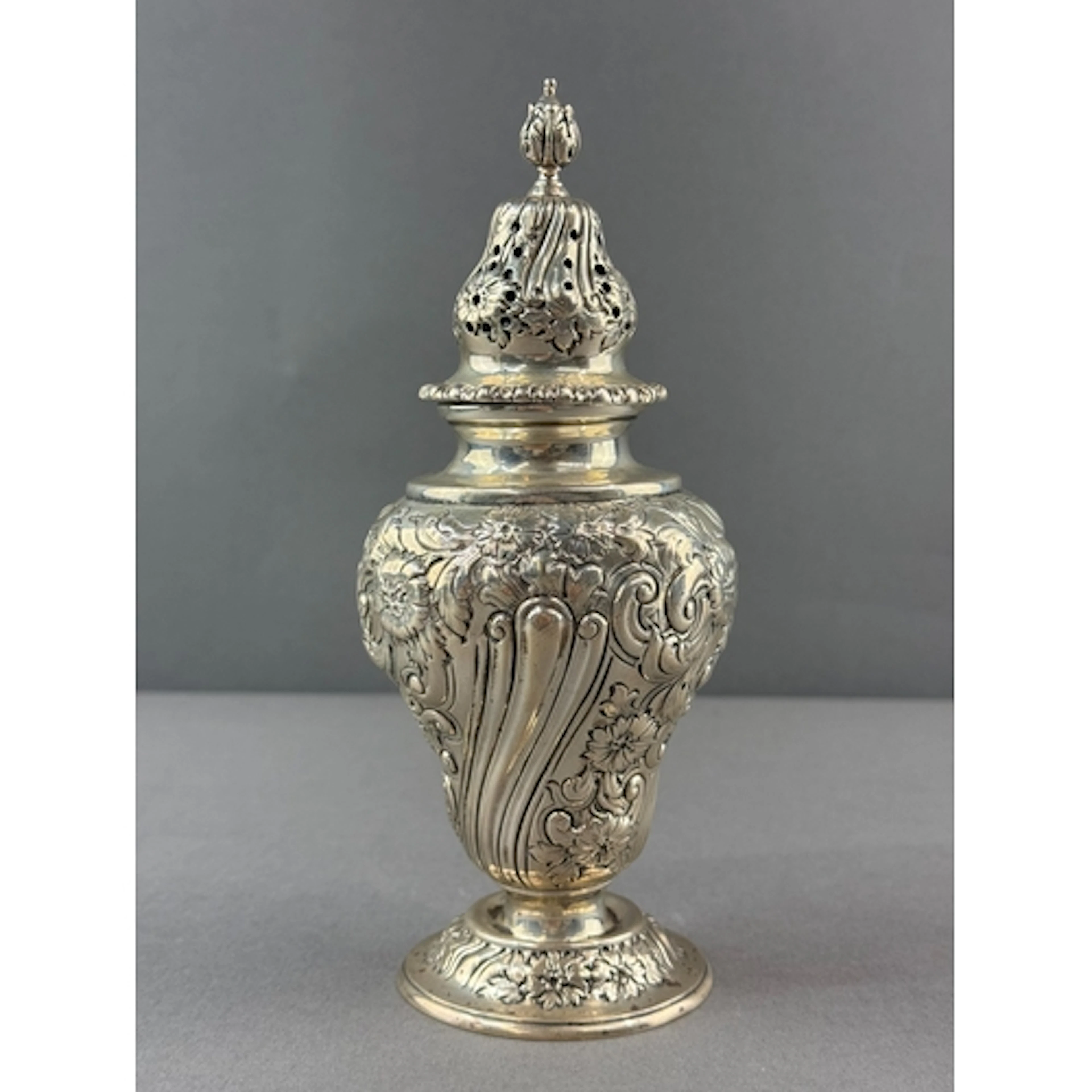 Silver: a caster of baluster form by The Goldsmiths & Si...