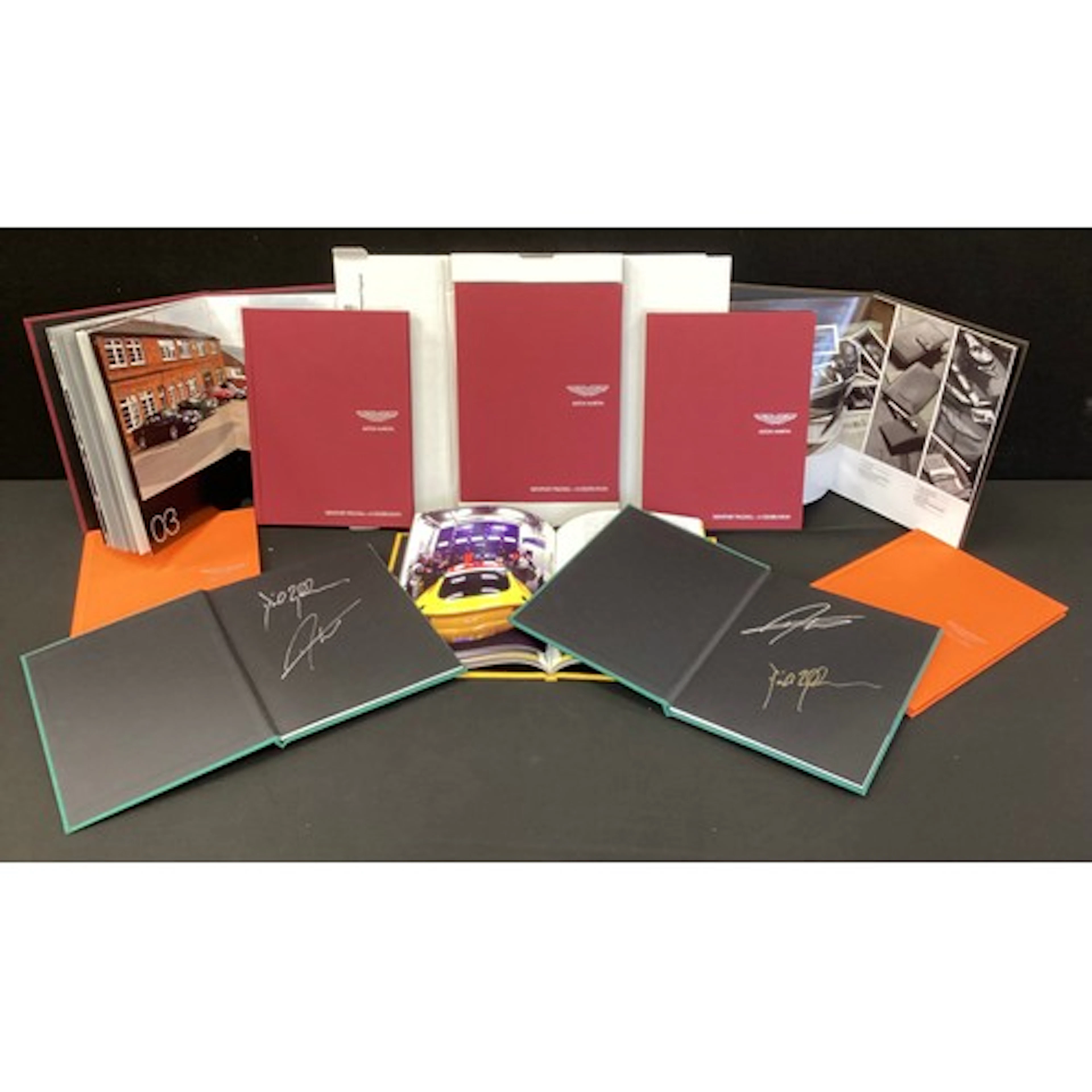 Automobilia - ten official Aston Martin hardback publication...