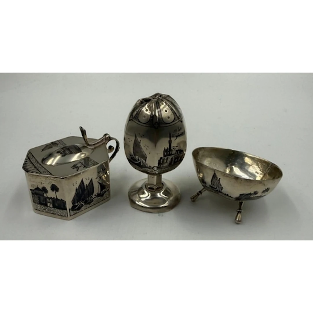 An Arabian silver cruet set. Approximate total weight 104g...