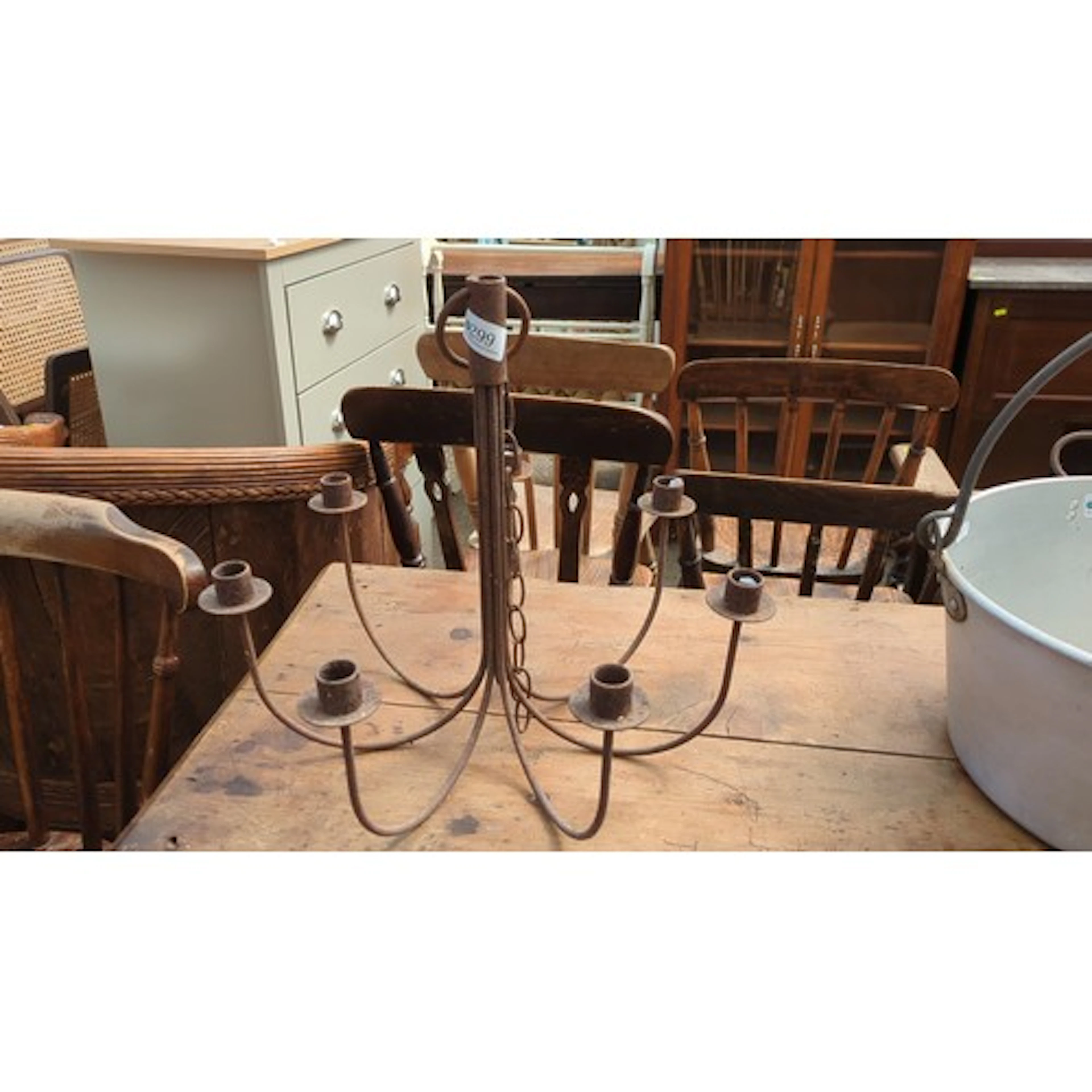 Six-light wrought-iron hanging chandelier.