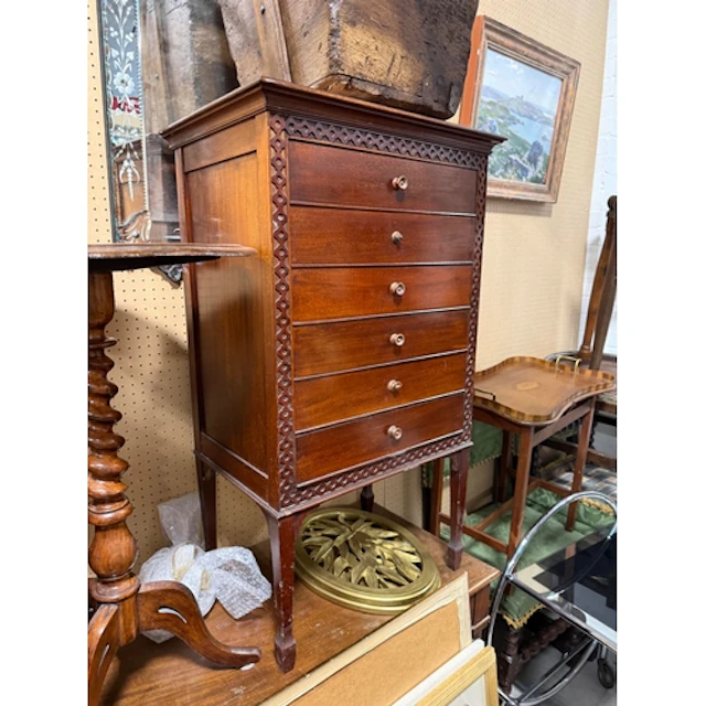 AN EDWARDIAN MAHOGANY MUSIC CABINET AND A SIMILAR PERIOD NES...