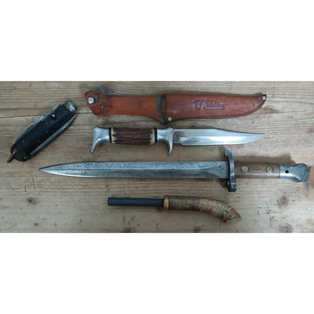 An Enfield bayonet, a German knife, penknife and a flint sti...