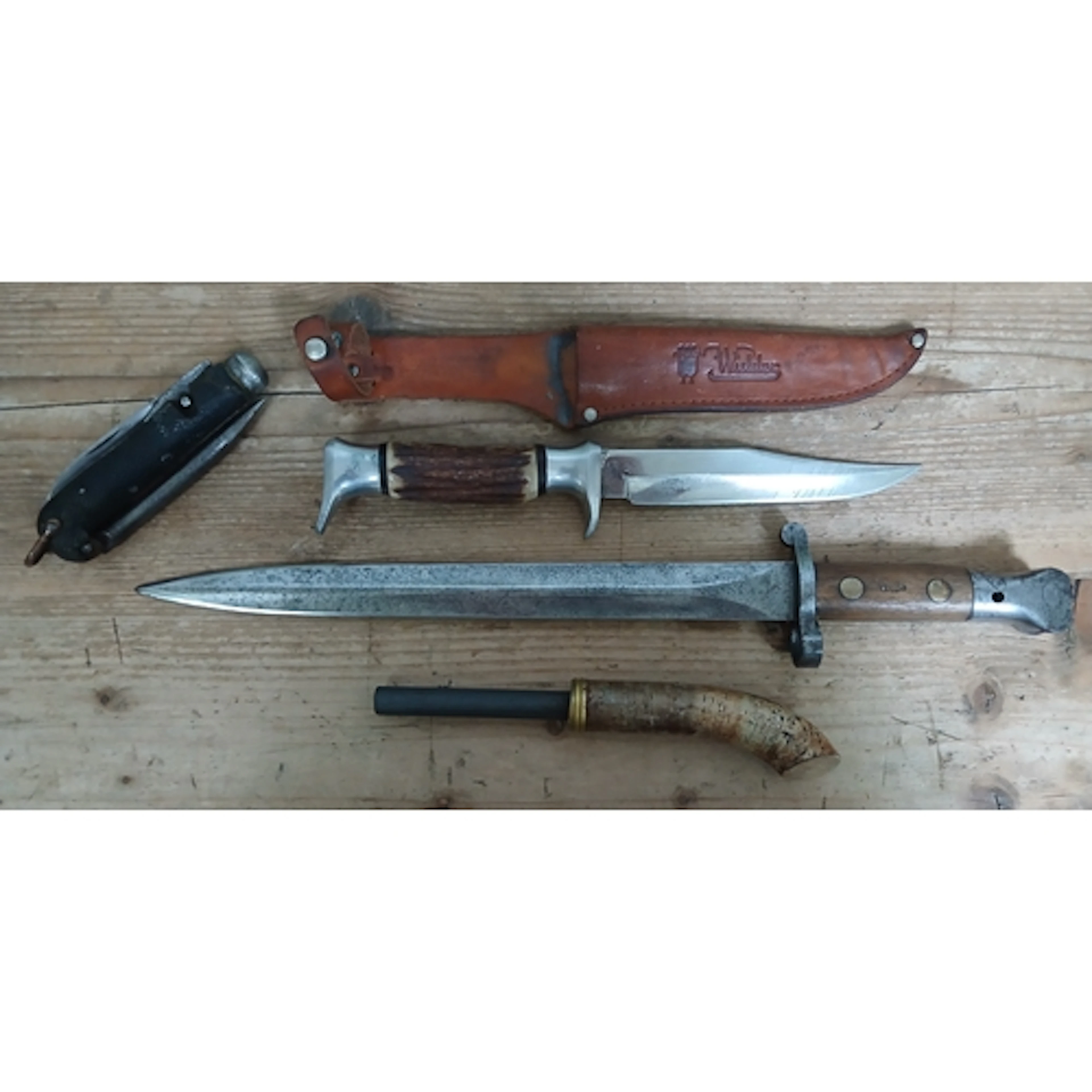 An Enfield bayonet, a German knife, penknife and a flint sti...