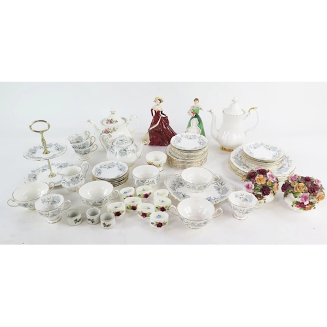 A Doulton figurine, HN 3096 'Merry Christmas', a Coalport fi...