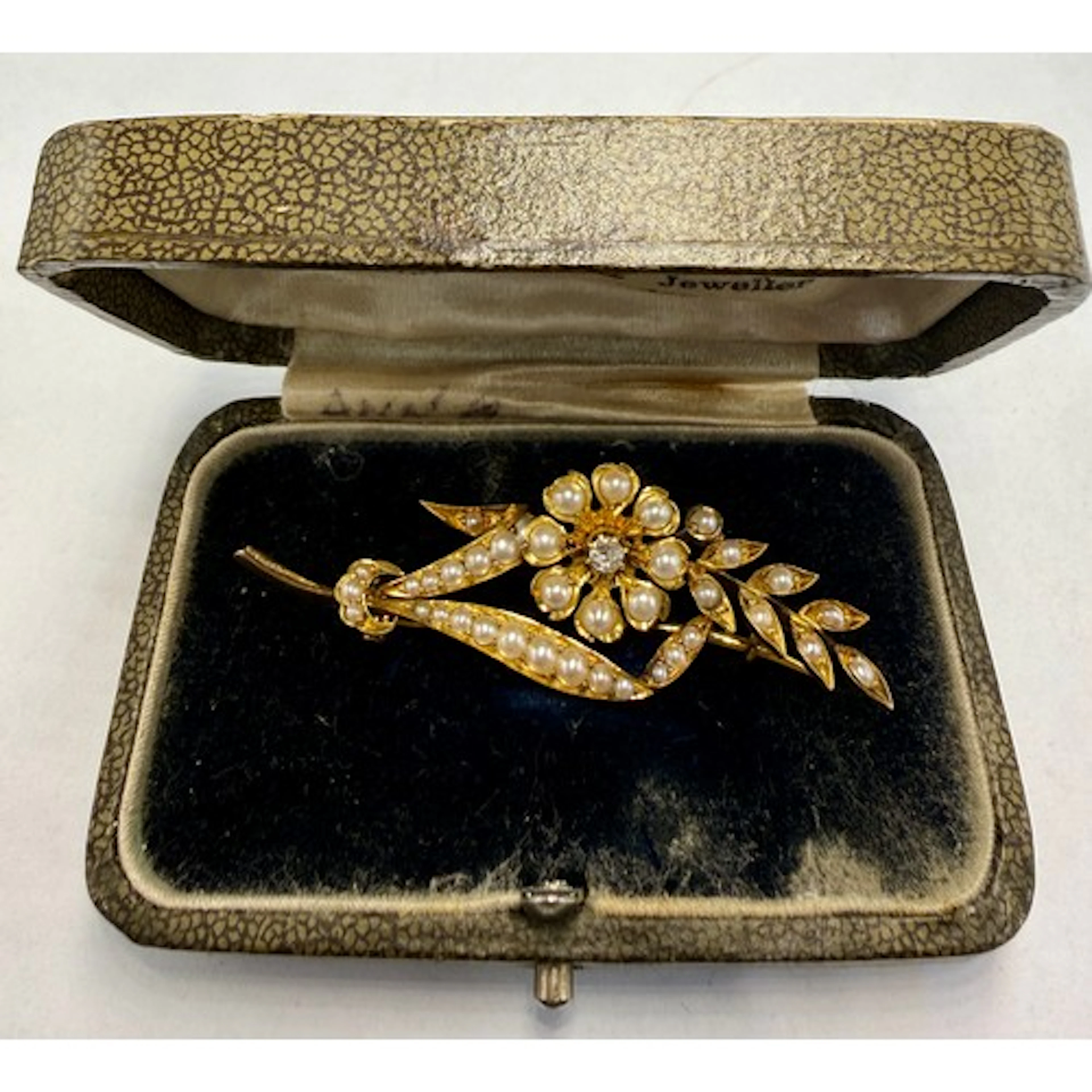 A 19thC unmarked yellow metal bar brooch set with seed pearl...