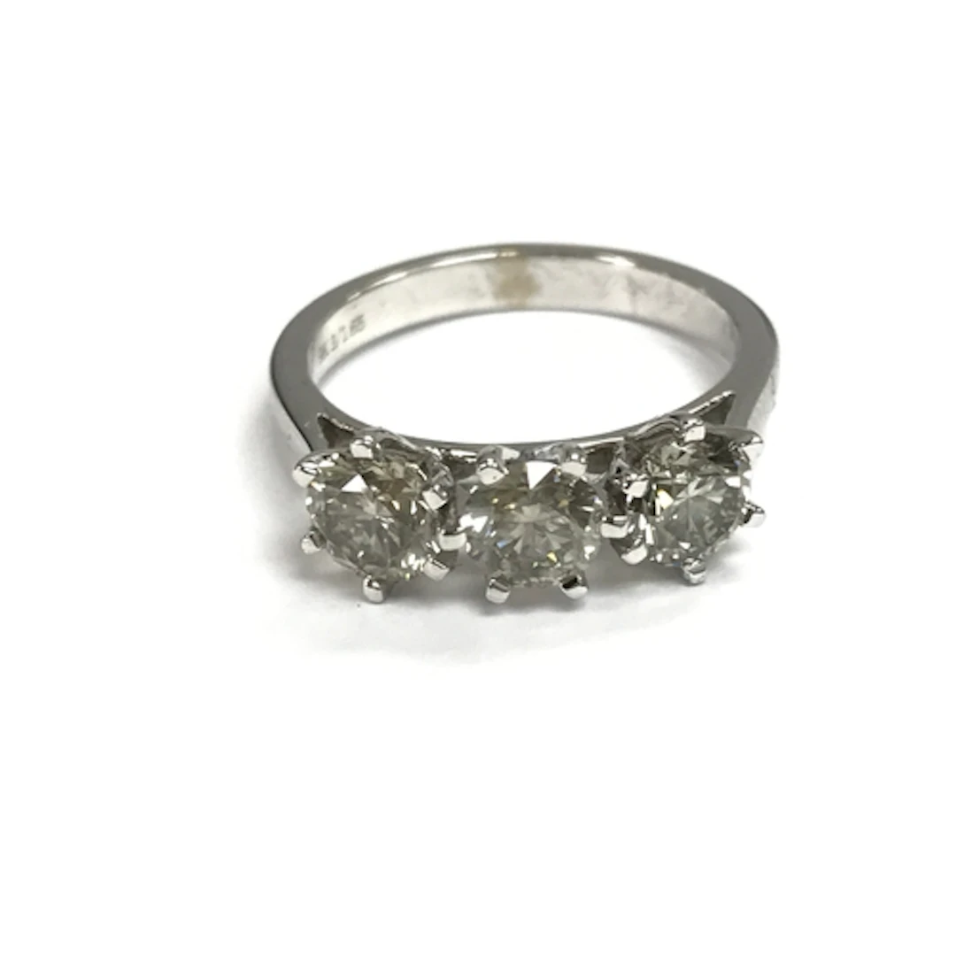 A 9ct white gold round cut diamonds trilogy ring. 1.65ct dia...