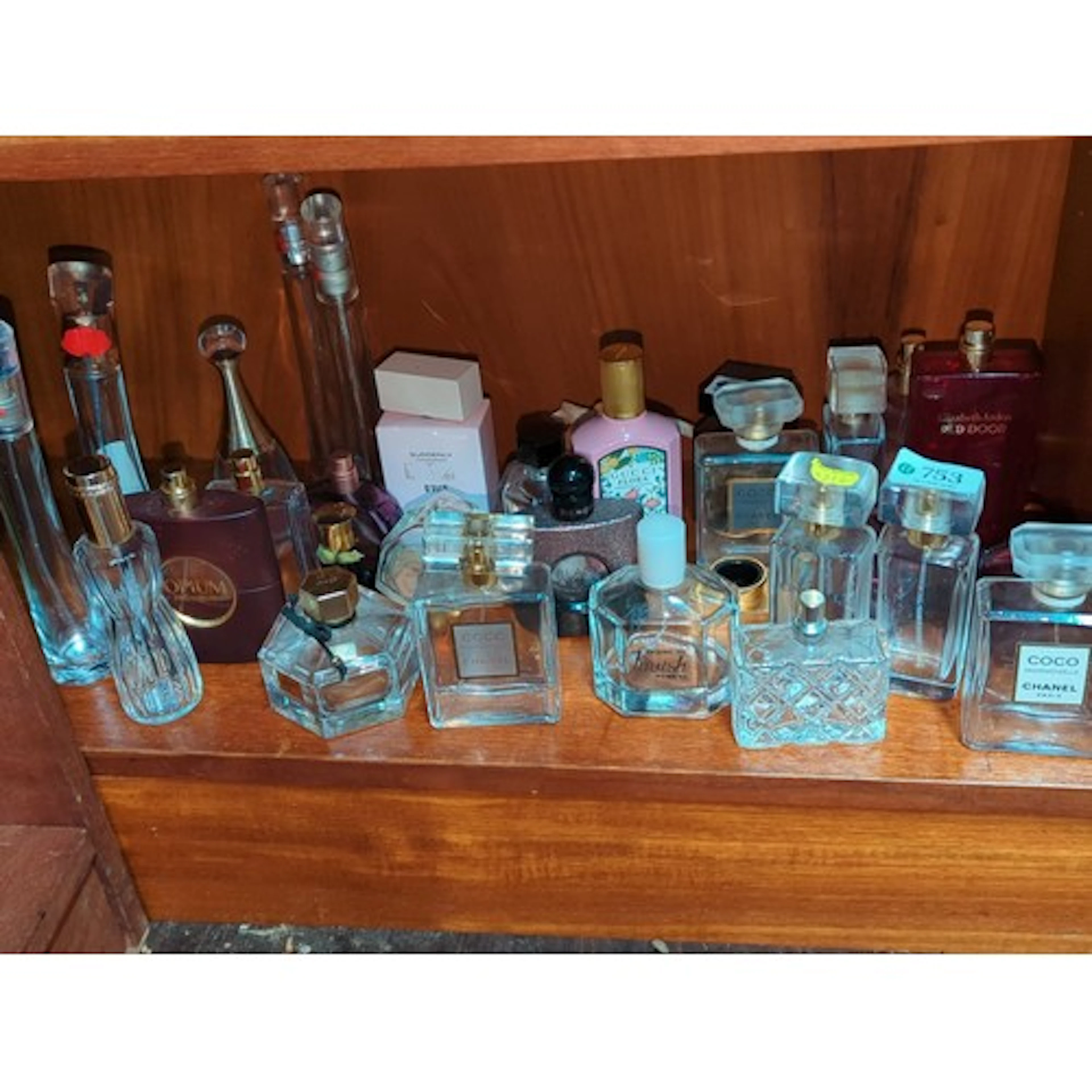 Group of assorted fragrance bottles and eau de parfum sprays...