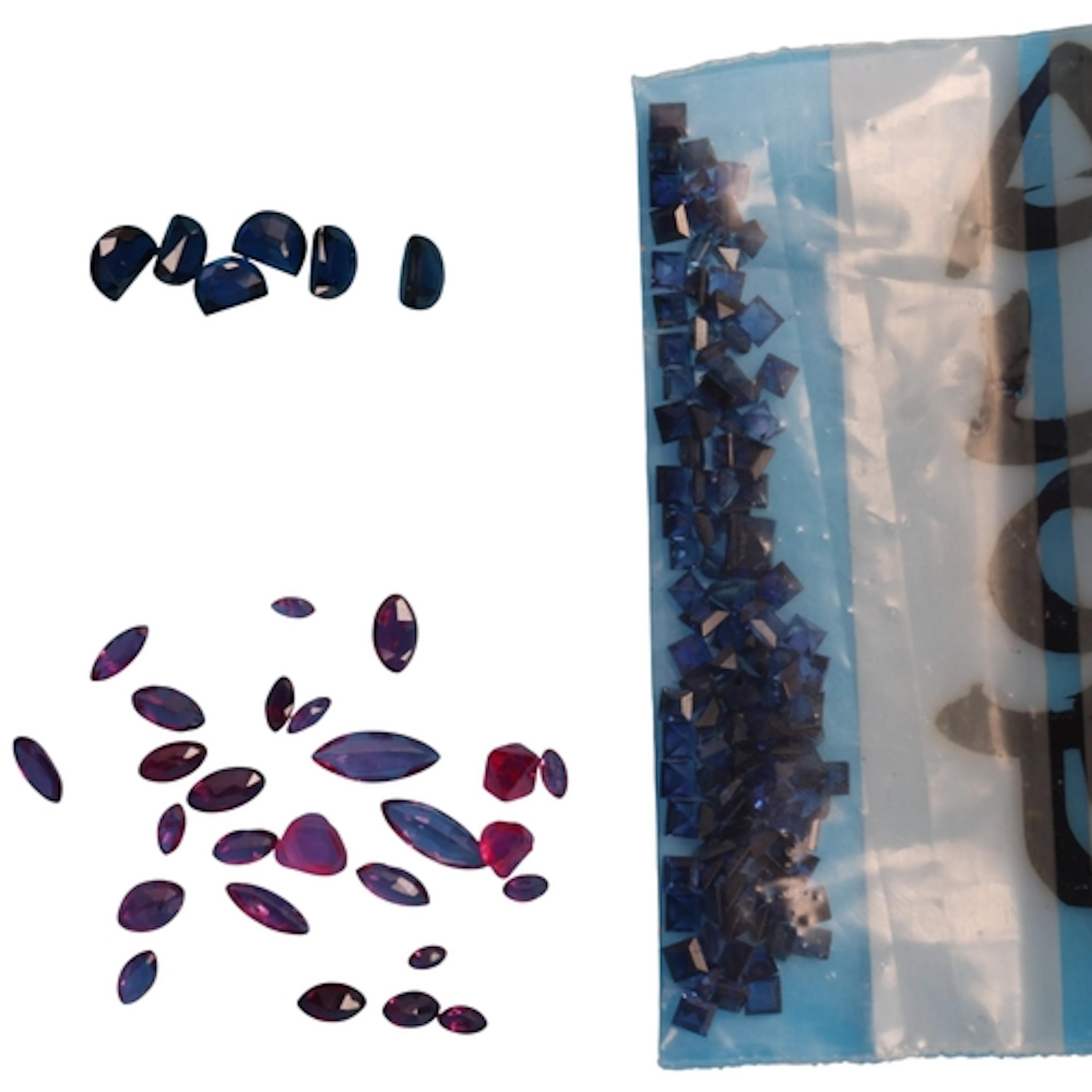 A quantity of unmounted sapphires and rubies, mix of natural...