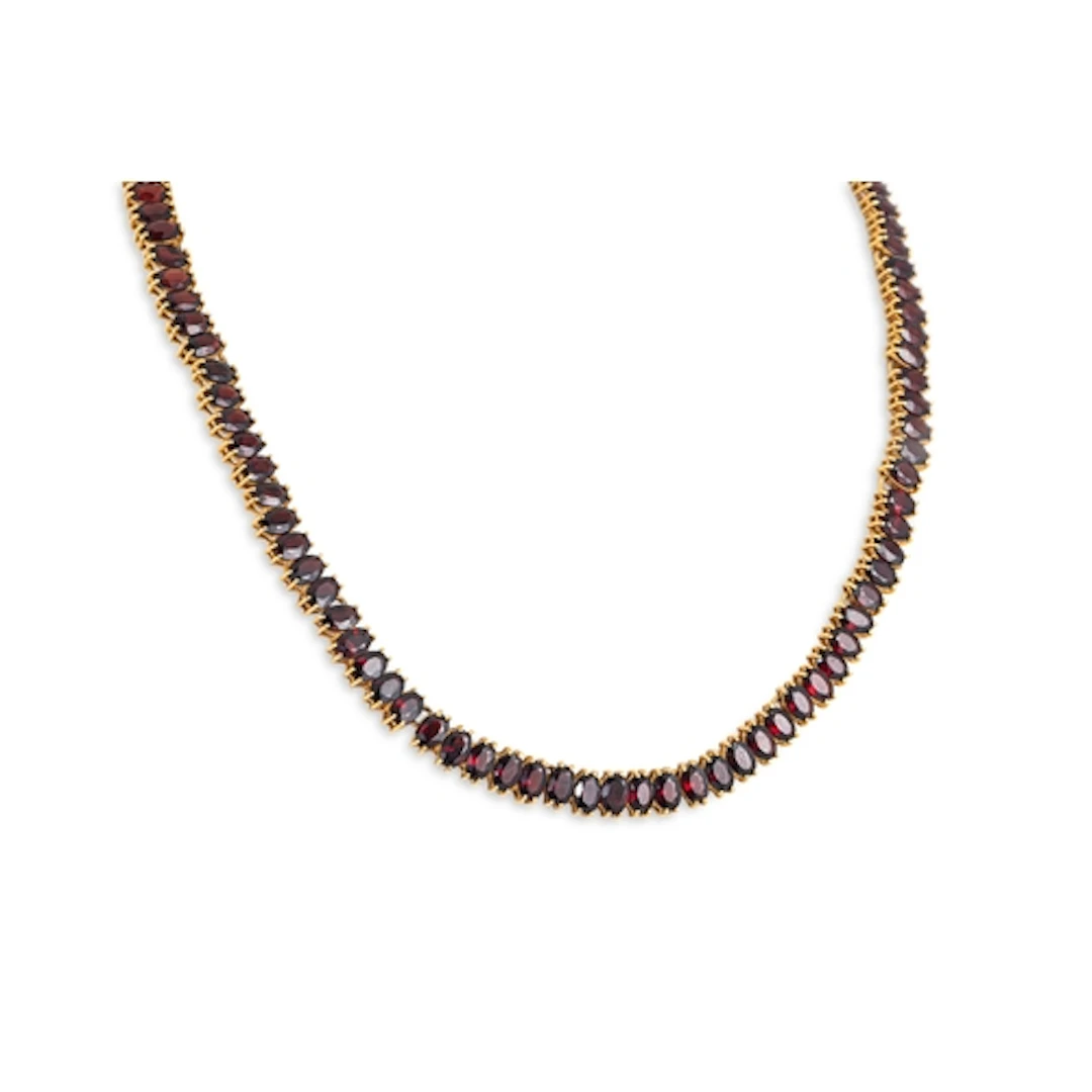 A GARNET SET NECKLACE, mounted in unmarked yellow gold, test...