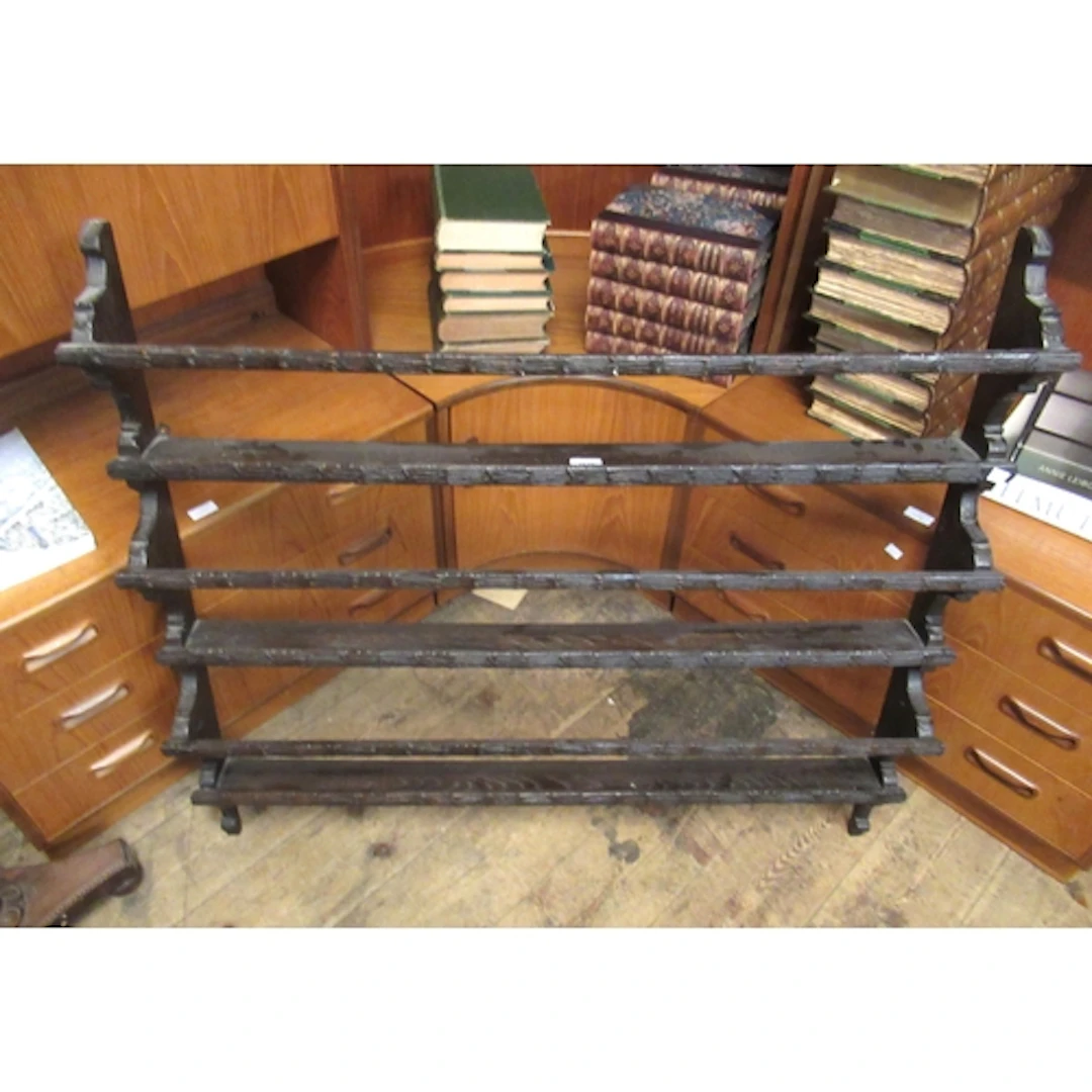 19th Century carved oak three shelf plate rack, 109cm wide