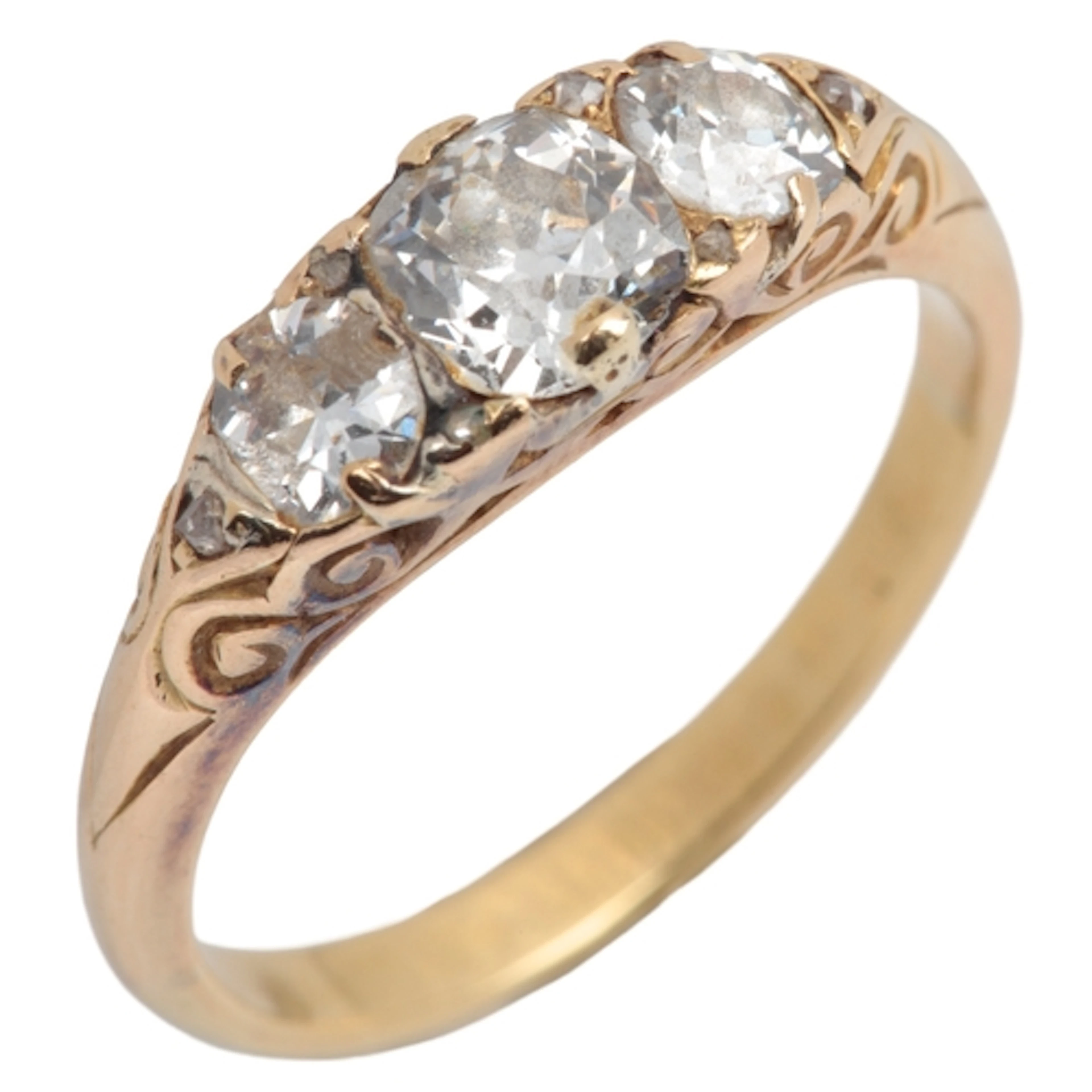 A three-stone diamond ring, late 19th century, centring on a...
