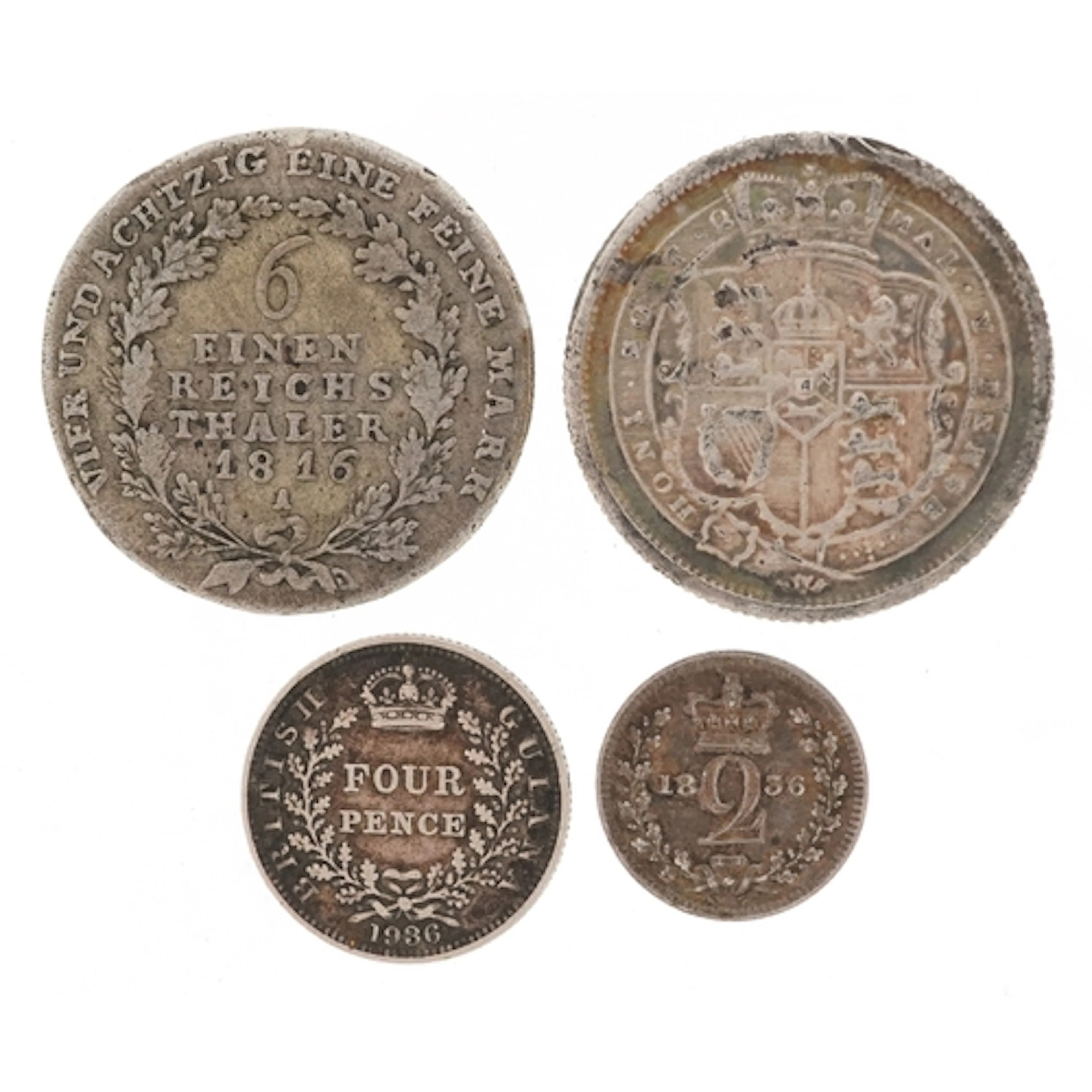 Four 19th century and later silver coins comprising a George...