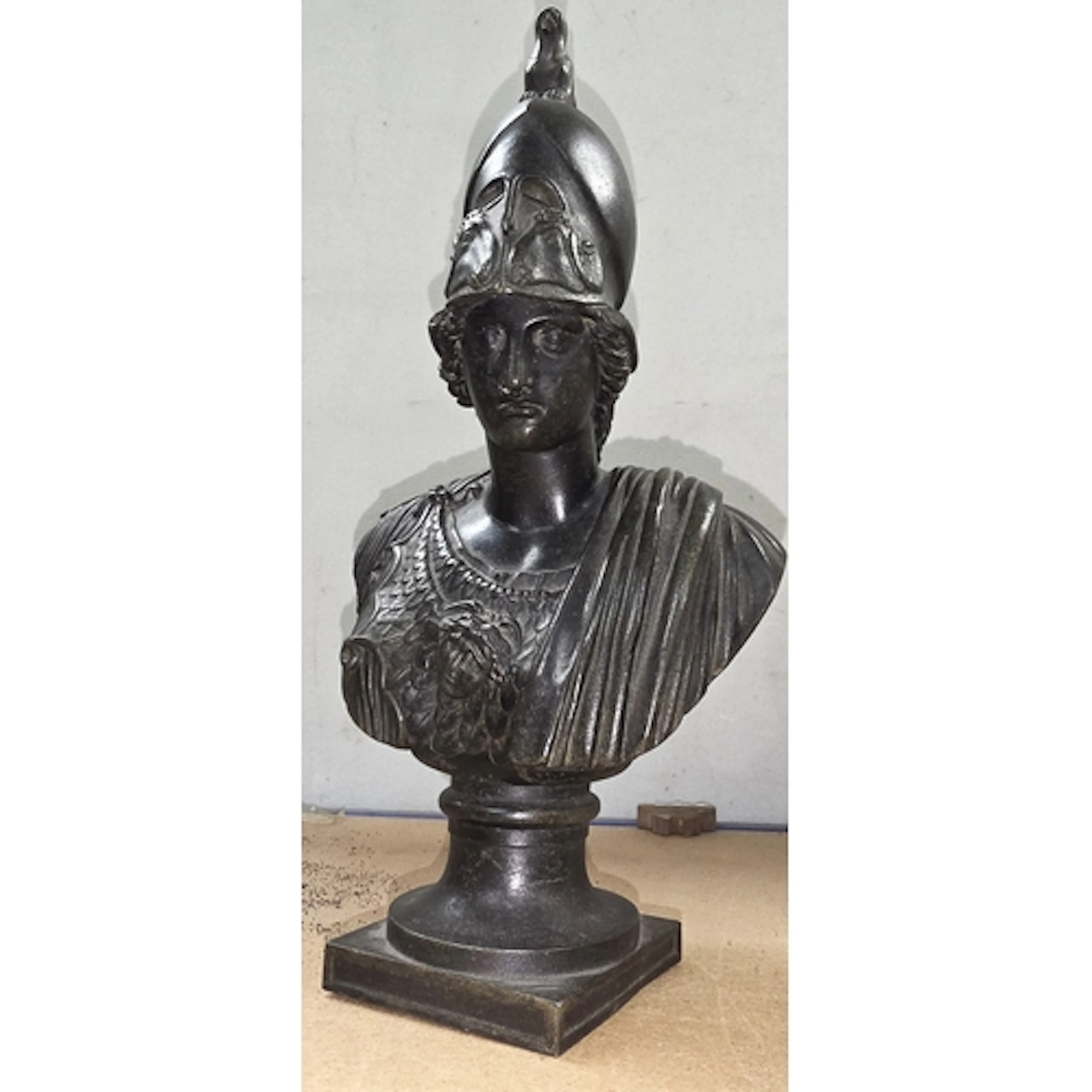 A 19th century 'Grand Tour' patinated bronze bust of Minerva...