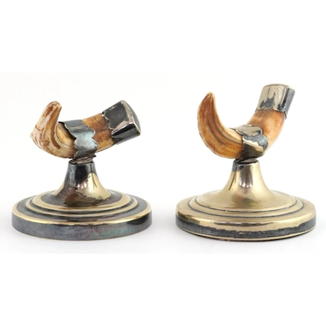 Pair of silver plated and warthog tusk knife rests, 7.5cm hi...