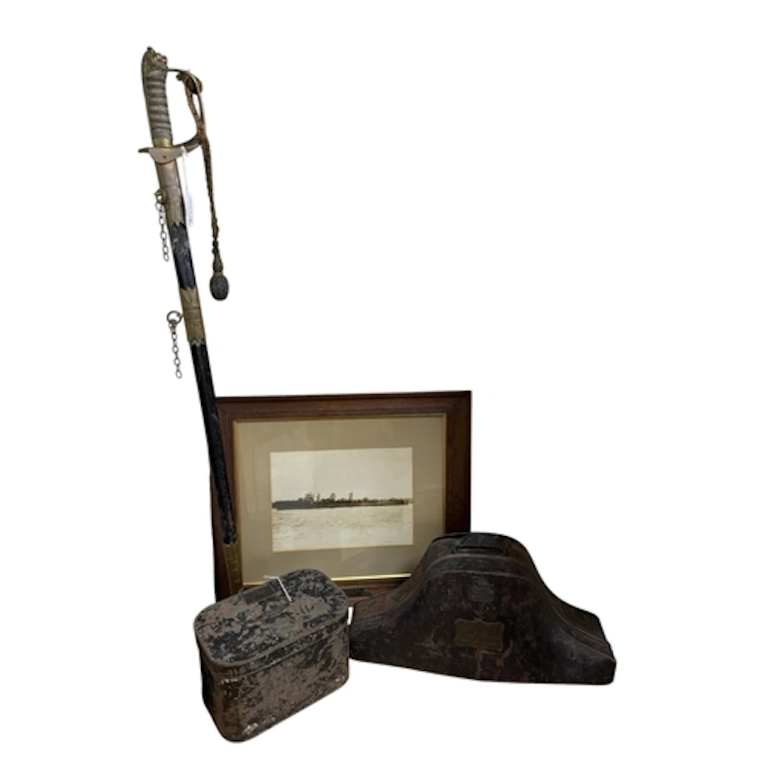A late Victorian naval officers sword together with tin case...