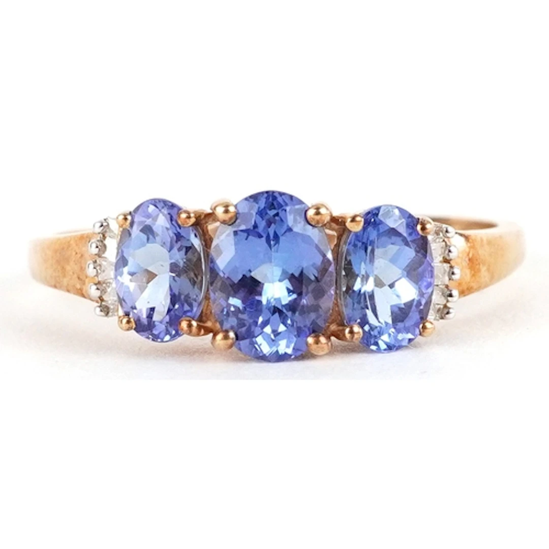9ct gold purple stone trilogy ring with diamond set shoulder...