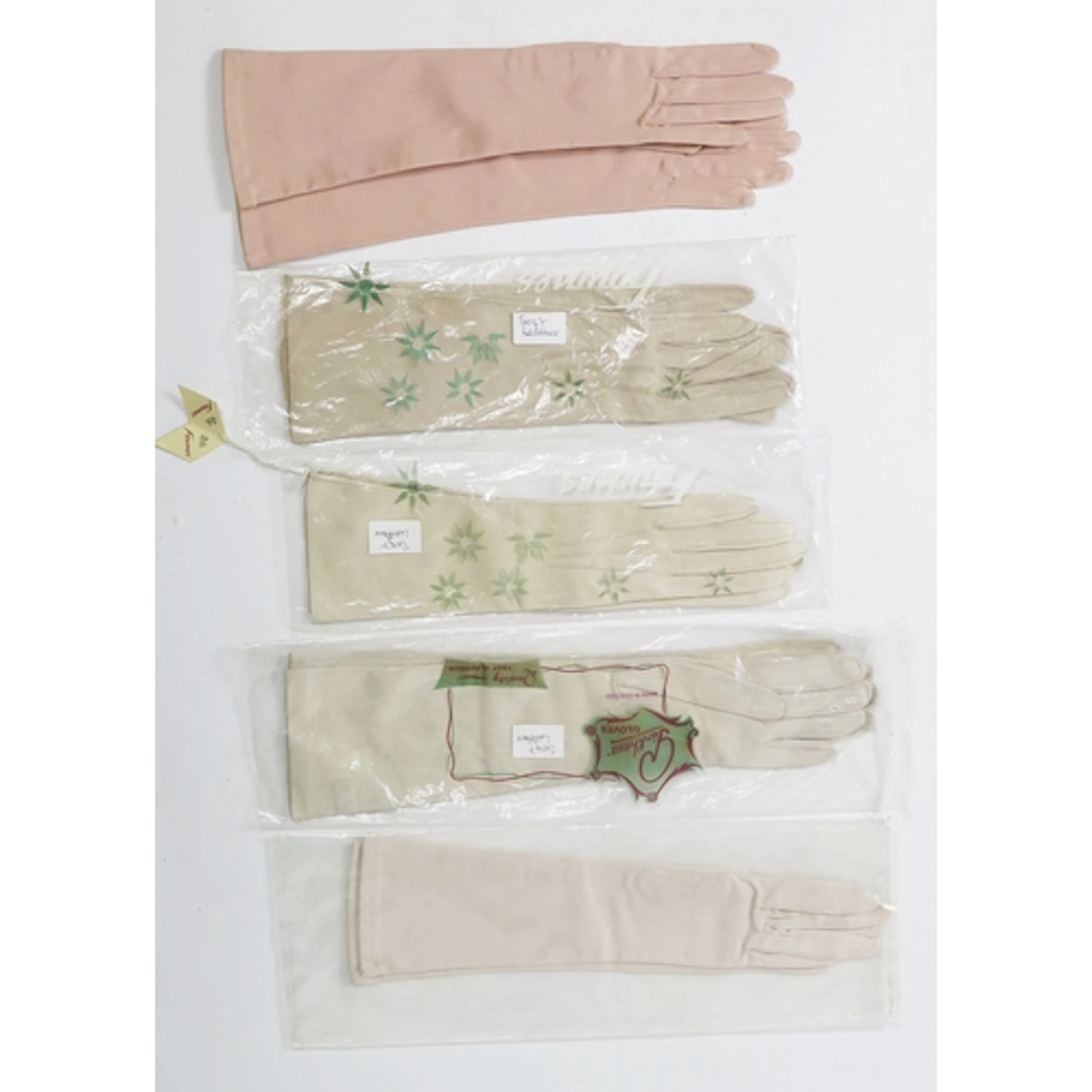 Three pairs of kid elbow length cocktail gloves, together wi...