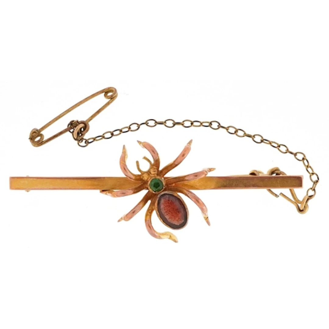 9ct gold garnet and green stone spider bar brooch, 5cm wide,...