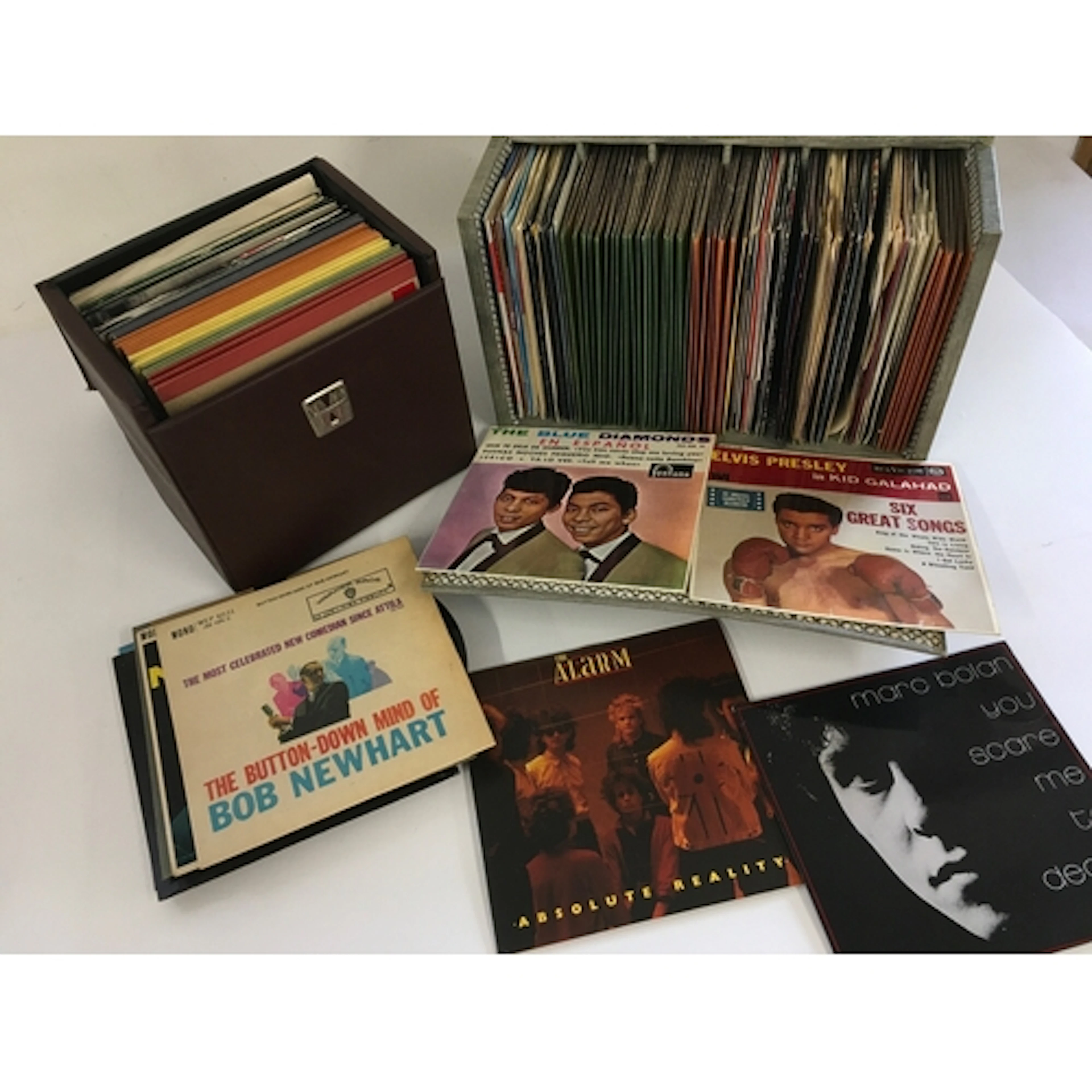 Three record cases of 7" singles and EPs by various artists ...