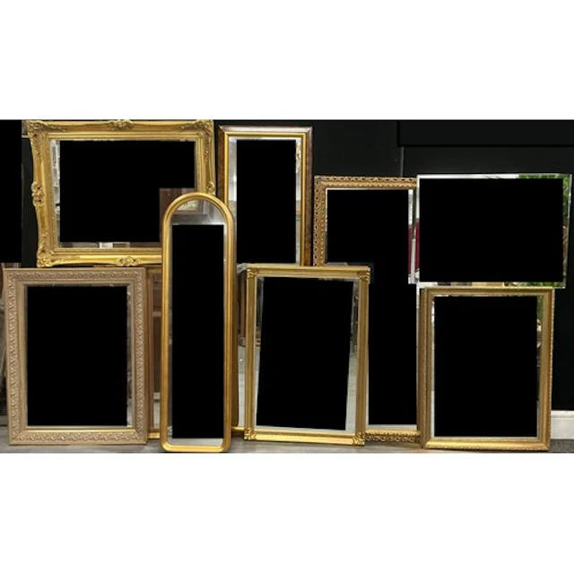 A pair of rectangular gilt framed wall mirrors, each with re...