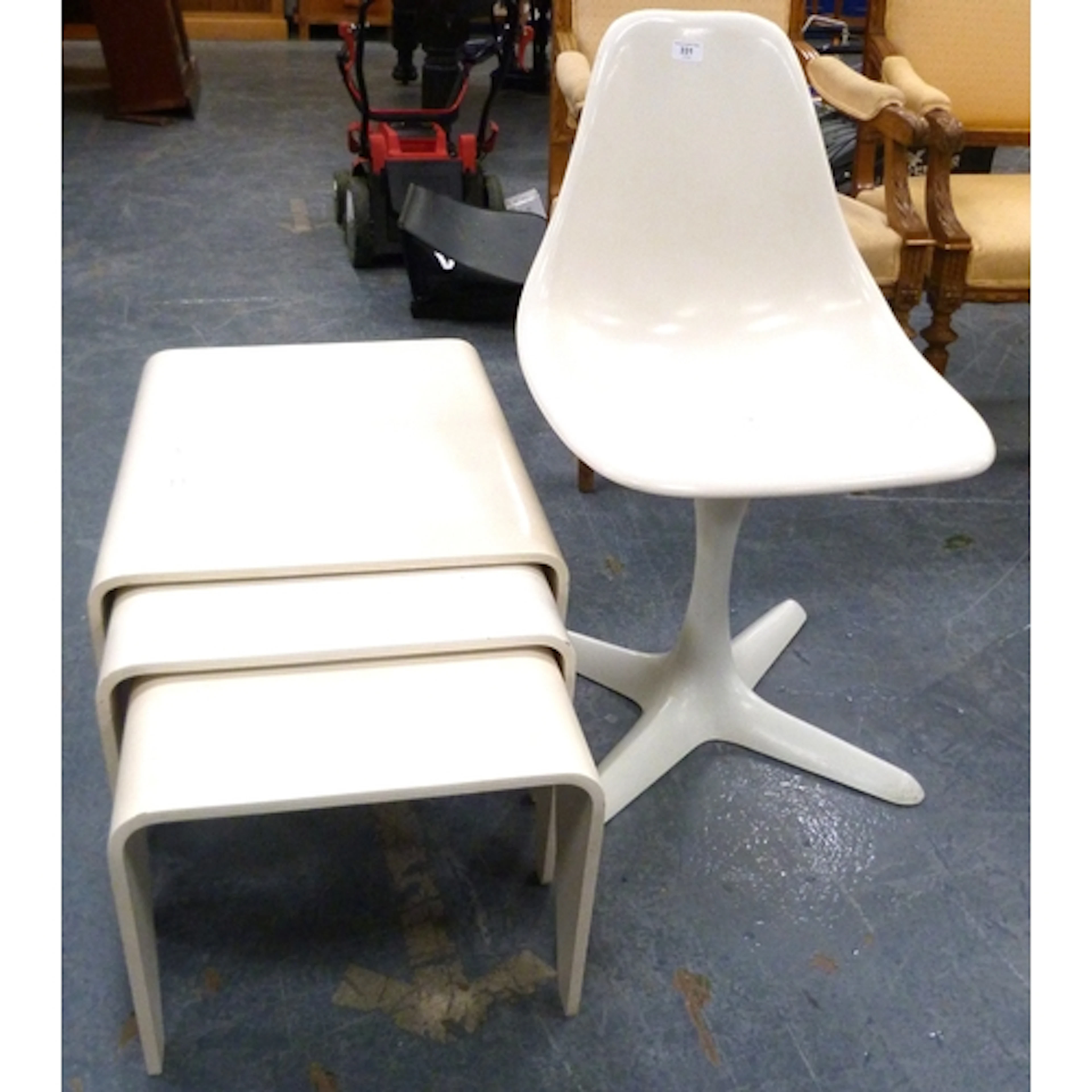 Contemporary white swivel chair and nest of three tables.