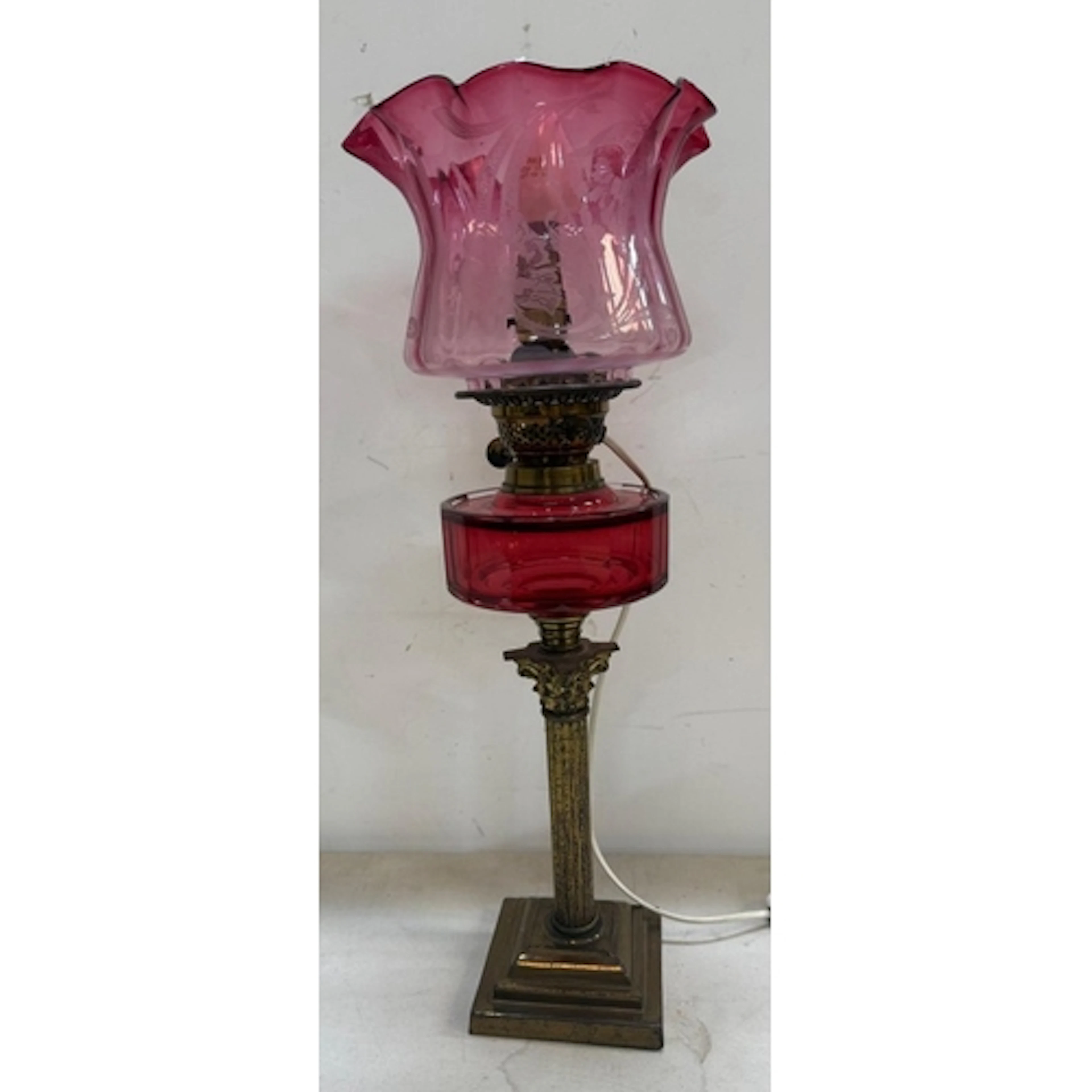 A Victorian converted oil lamp with brass empire style centr...