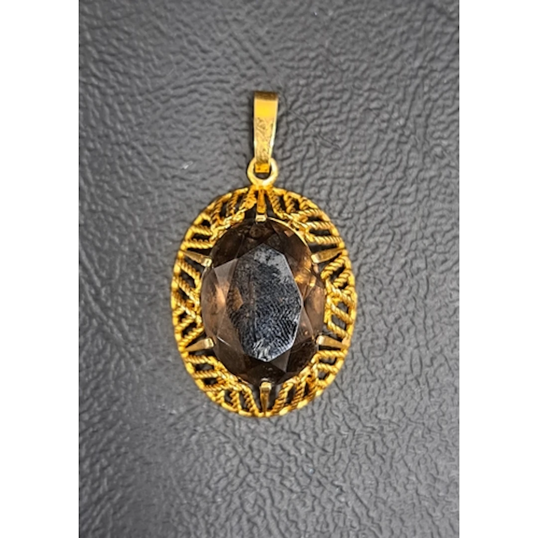 SMOKY TOPAZ SET PENDANT in basket effect nine carat gold mou...