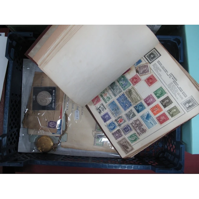 Stamps; A World stamp collection, housed in an old 'Express'...