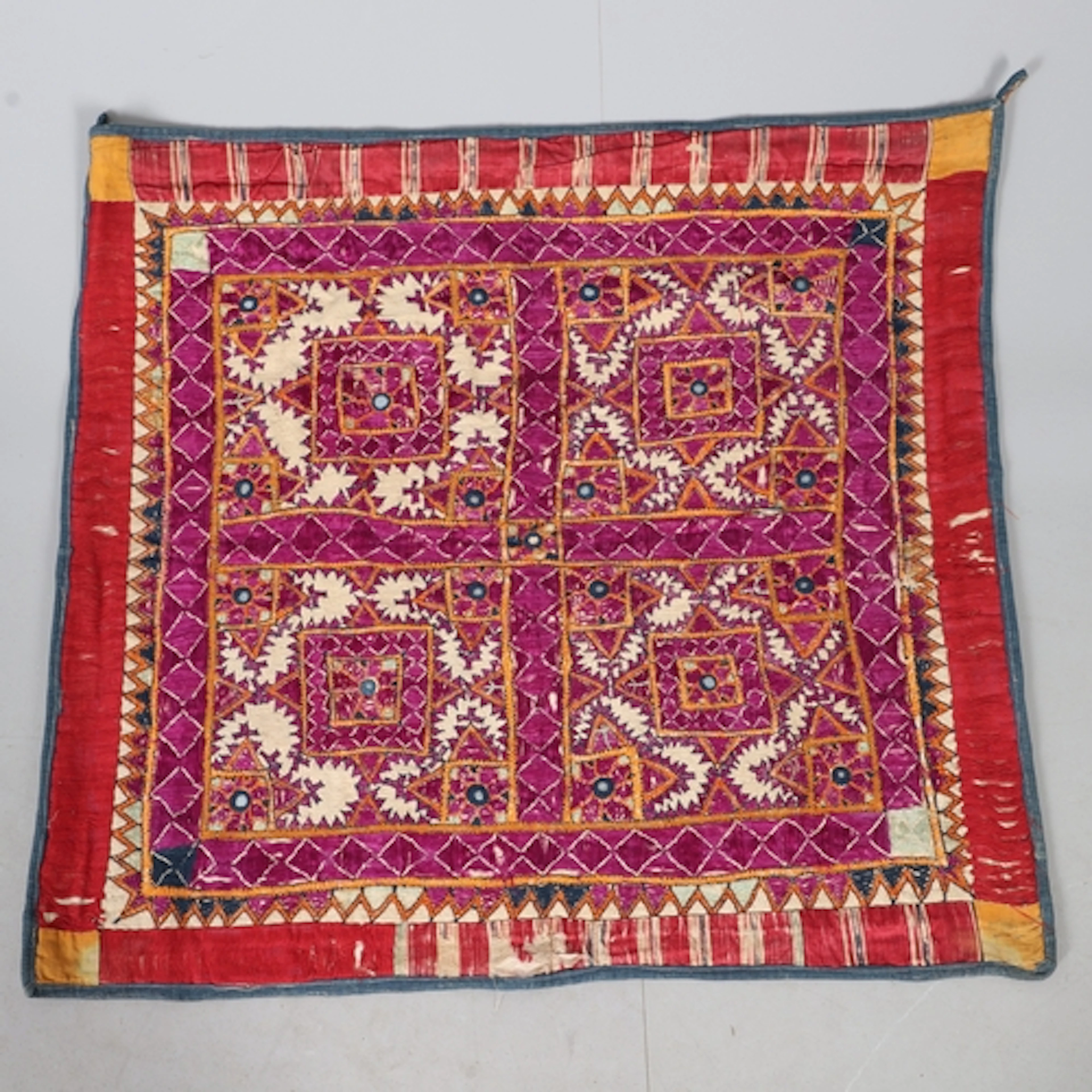 A PANEL OF INDIAN EMBROIDERY. late 19th century, worked in p...
