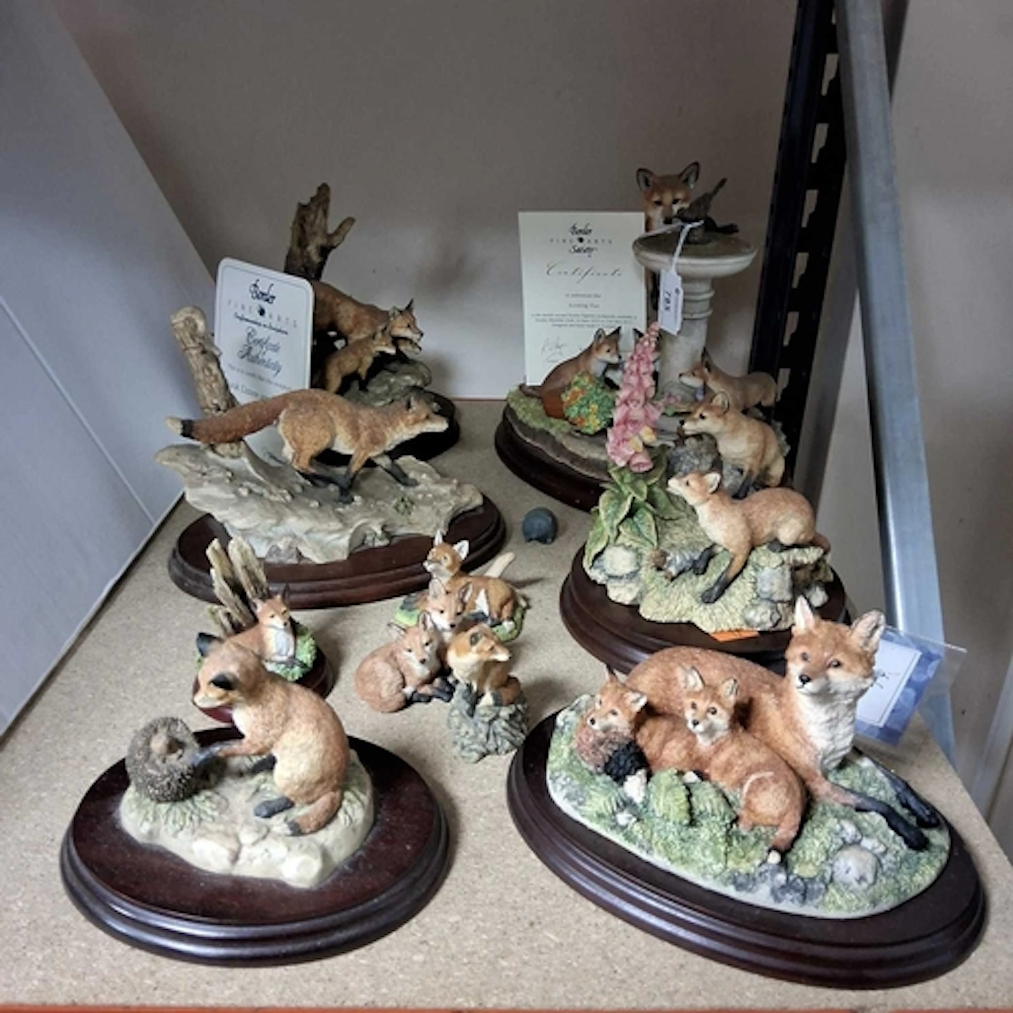 A GROUP OF TEN BORDER FINE ARTS FOX SCULPTURES, comprising '...