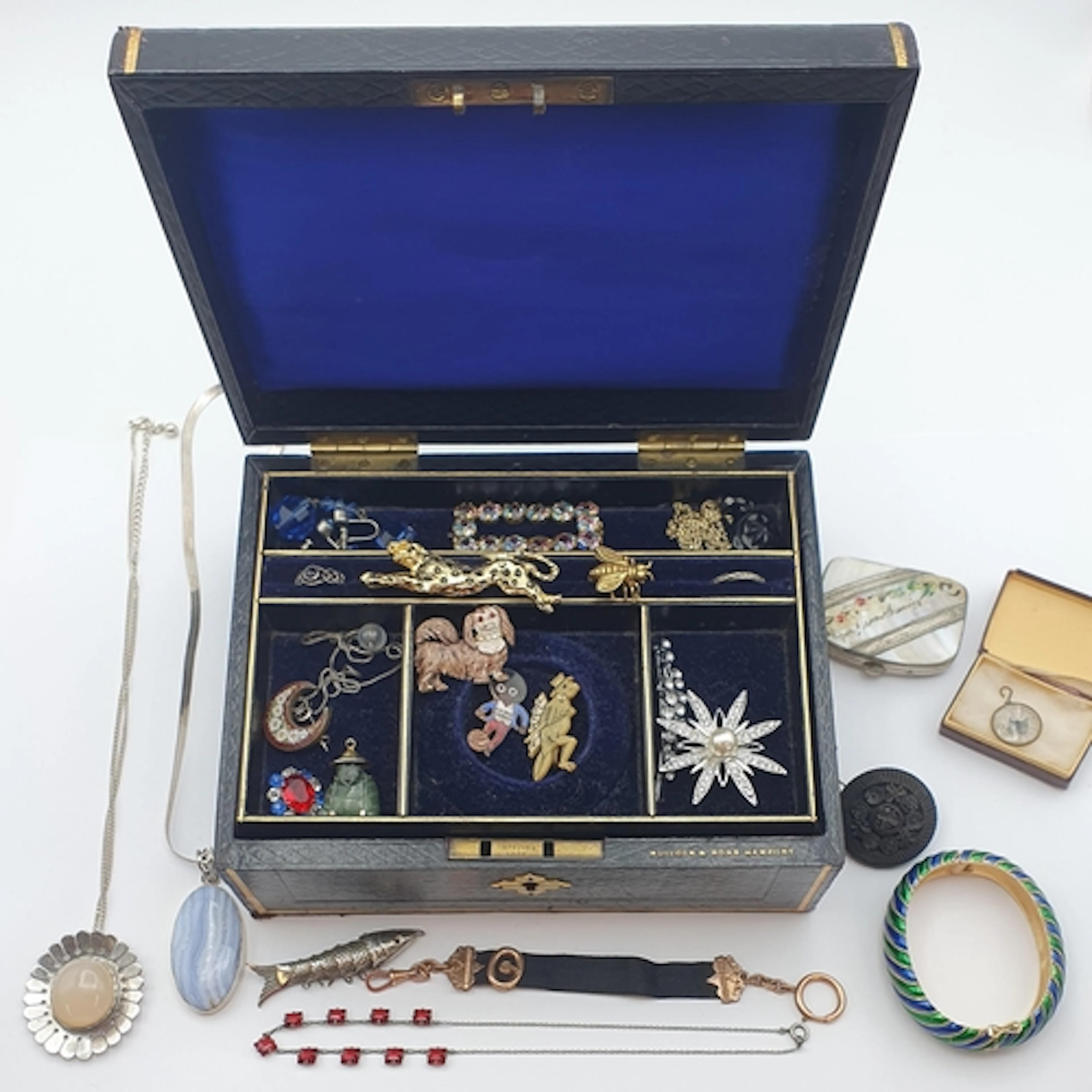 An Edwardian black leather Jewel Box containing an interesti...