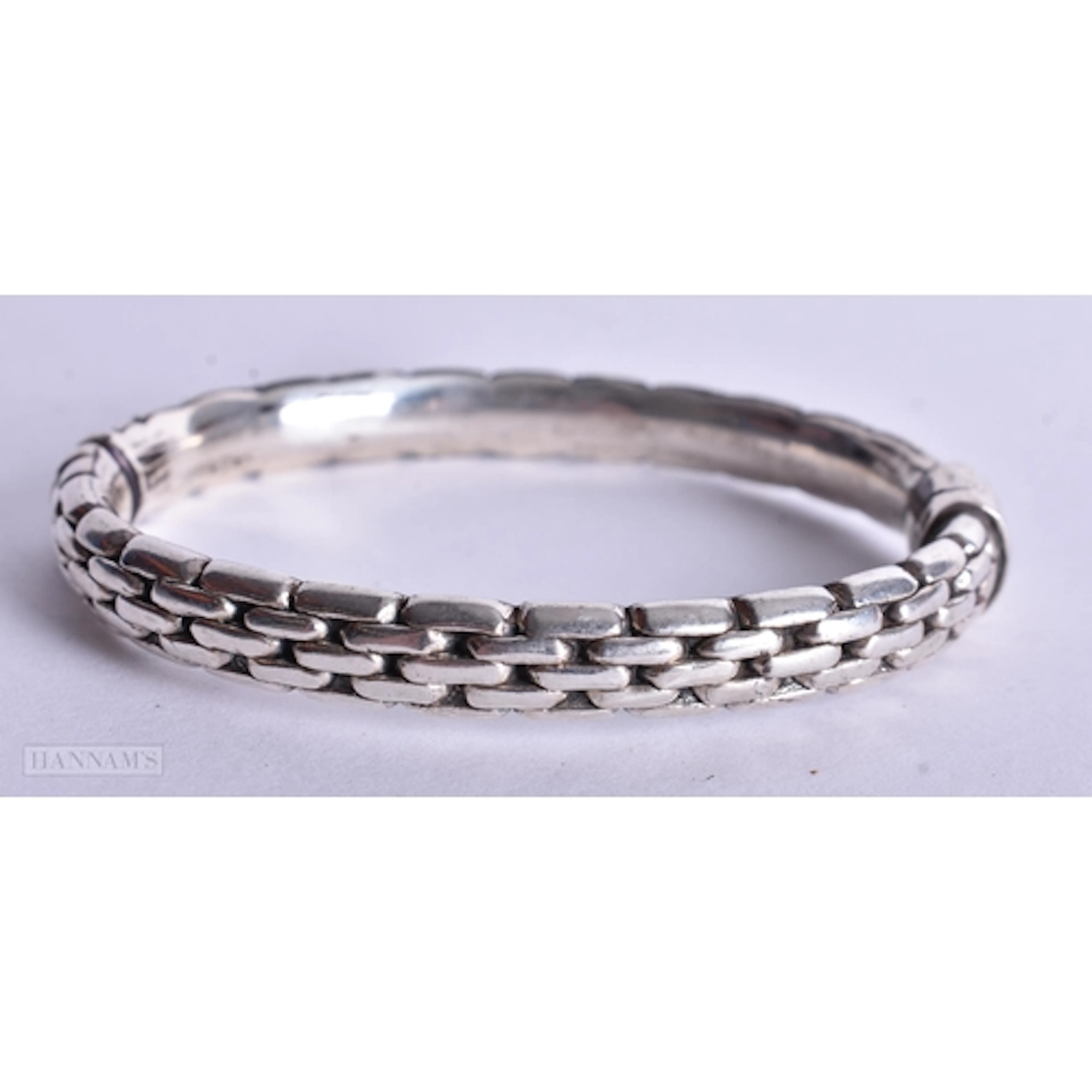 A Silver Bangle. Stamped 925. Internal 5.9cm x 5.1cm, weig...