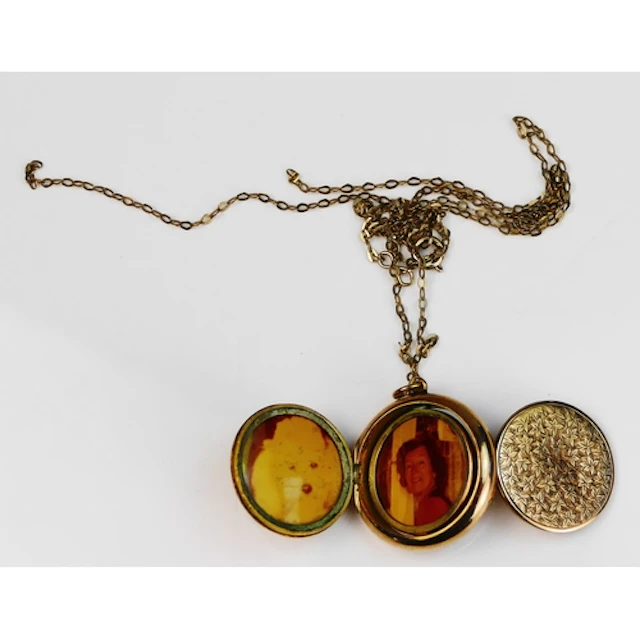 An antique patented 9ct gold quadruple locket with swivel ce...